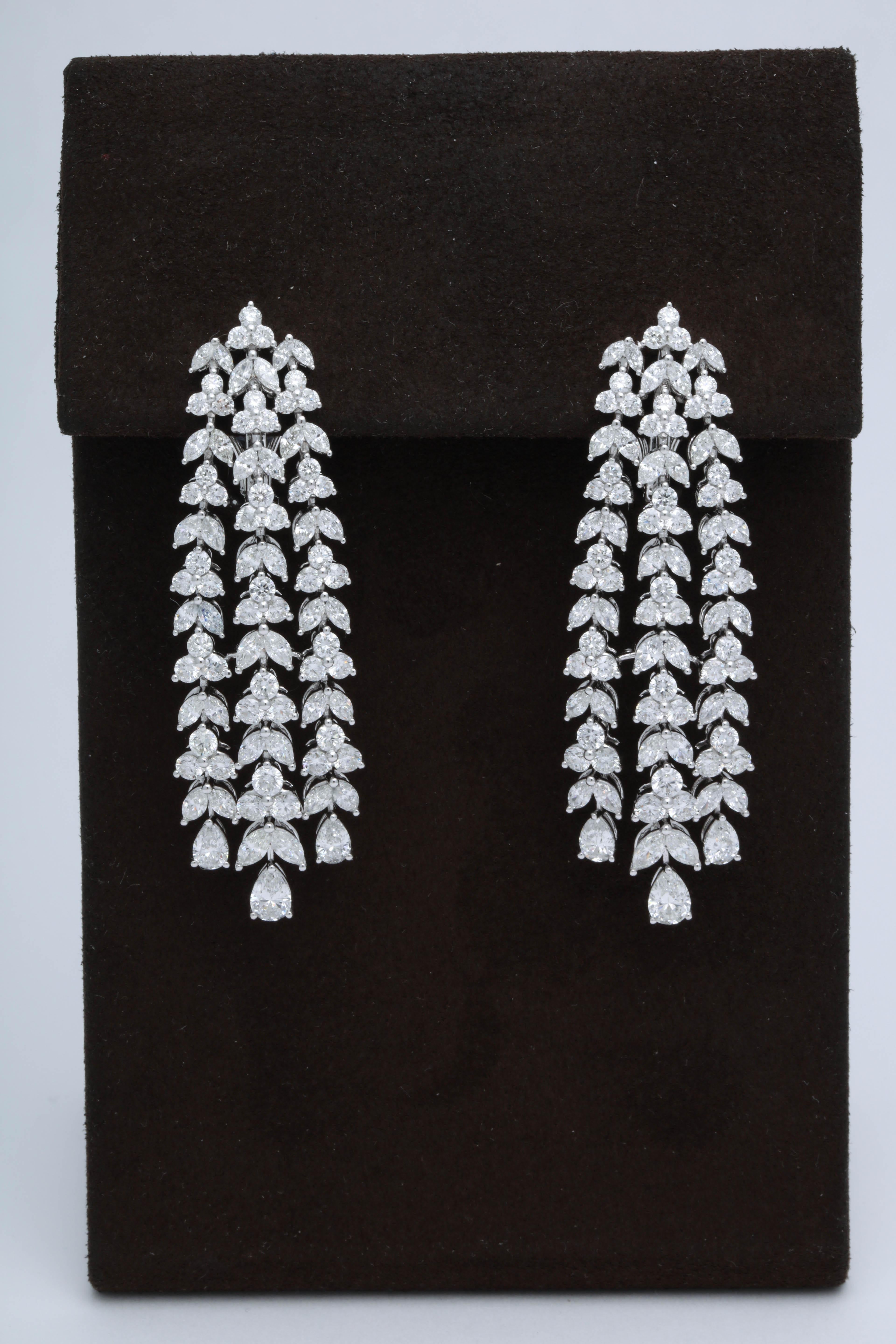 
An impressive dangle earring, full of SPARKLE.

10.52 carats of round, marquise and pear shaped white diamonds set in 18k white gold. 

Approximately 2.25 inches from its highest to lowest point, about half an inch wide. 

A fabulous earring with a