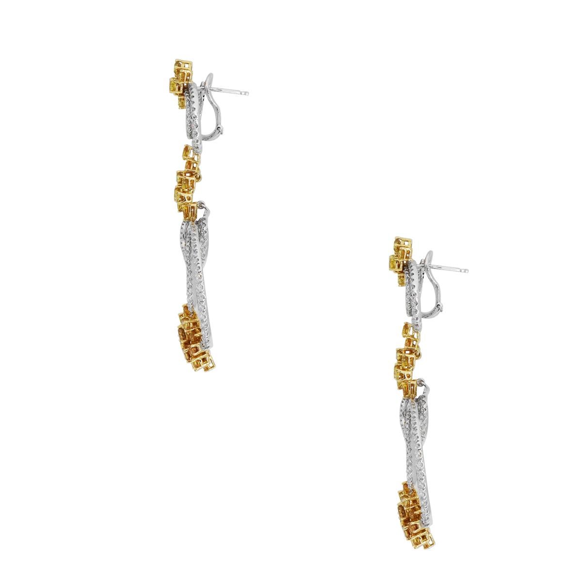 Material: 18k White Gold and 18k Yellow Gold
Diamond Details: Approximately 4.20ctw yellow and orange diamonds and approximately 4.50ctw white diamonds. White Diamonds are G/H in color and VS in clarity.
Earring Measurements: 1.25″ x 0.36″ x