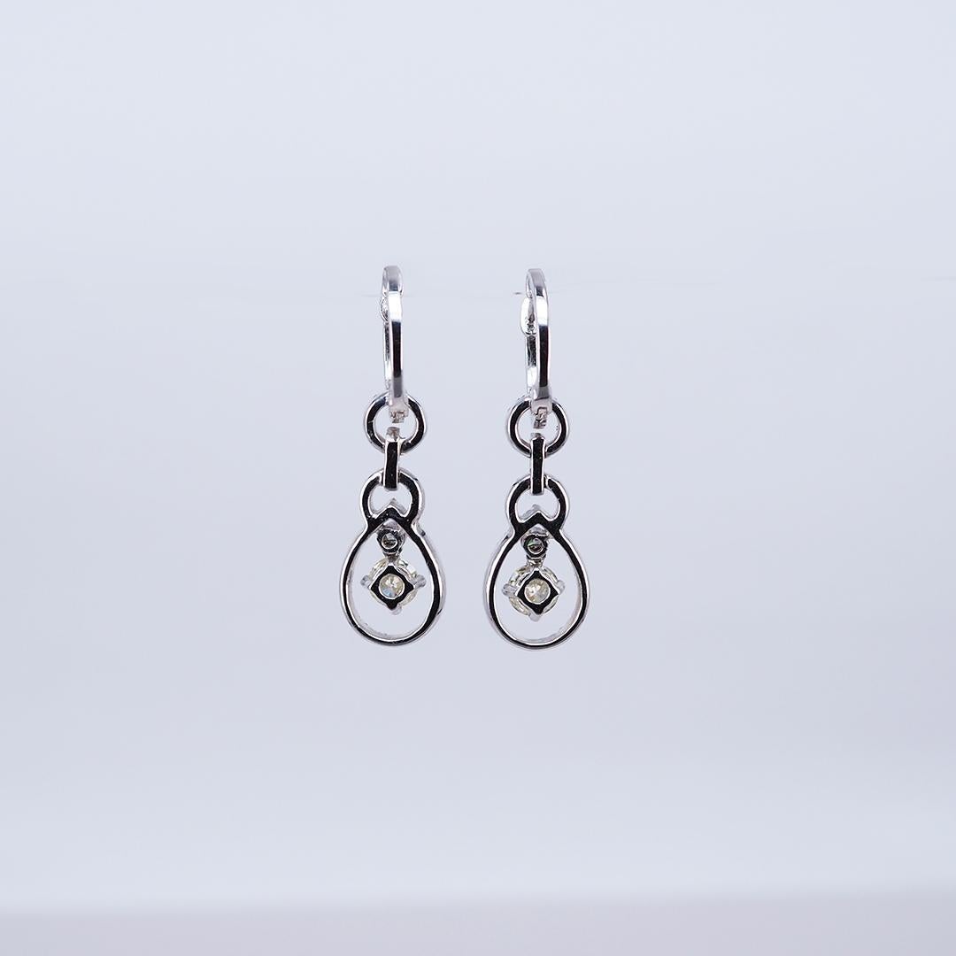 A lovely diamond earrings that you can use in cocktail party.The design is very elegant look.Big size 2 Diamonds use 0.95 ct J VS, Small size Diamond use 0.70 ct H VS quality, the setting made in 18k White gold