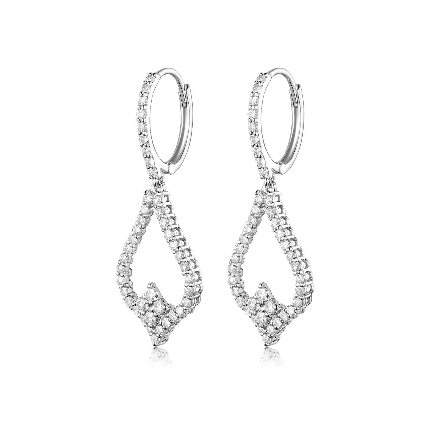 Elevate your jewelry collection with these sophisticated earrings, brilliantly crafted in gleaming 18 karat gold. At the heart of the design, shimmering round diamonds, weighing a total of 0.74 carats, take center stage, exuding timeless elegance