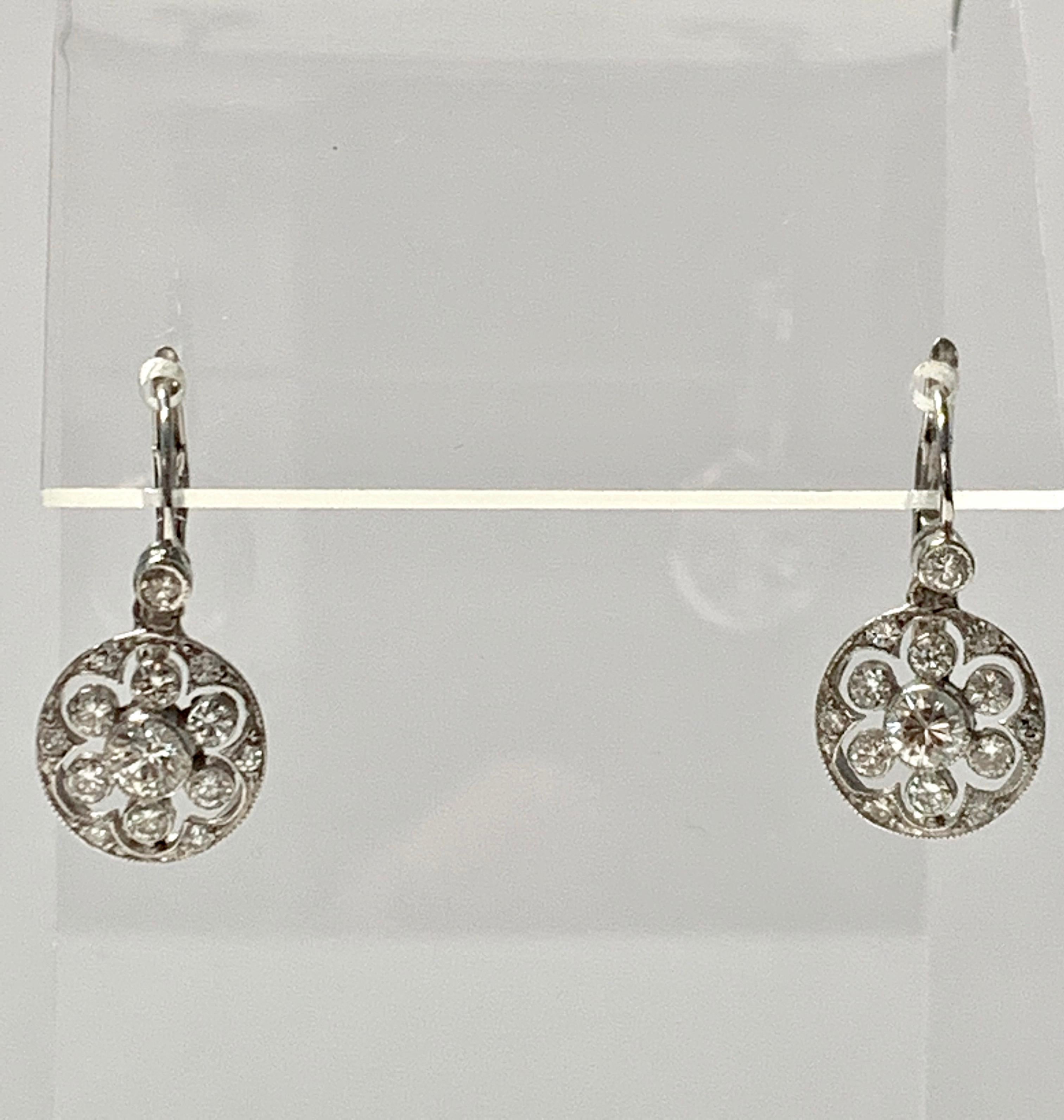 Very pretty diamond dangle earrings handcrafted in 18k white gold. 
The details are as follows : 
Diamond weight : 1.20 carat ( GH color and SI clarity ) 
Measurements : 0.50 inch long , 11.5 mm 
metal : 18k white gold 


