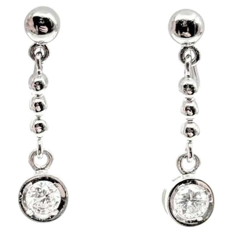 Diamond Dangle Earrings in Platinum For Sale
