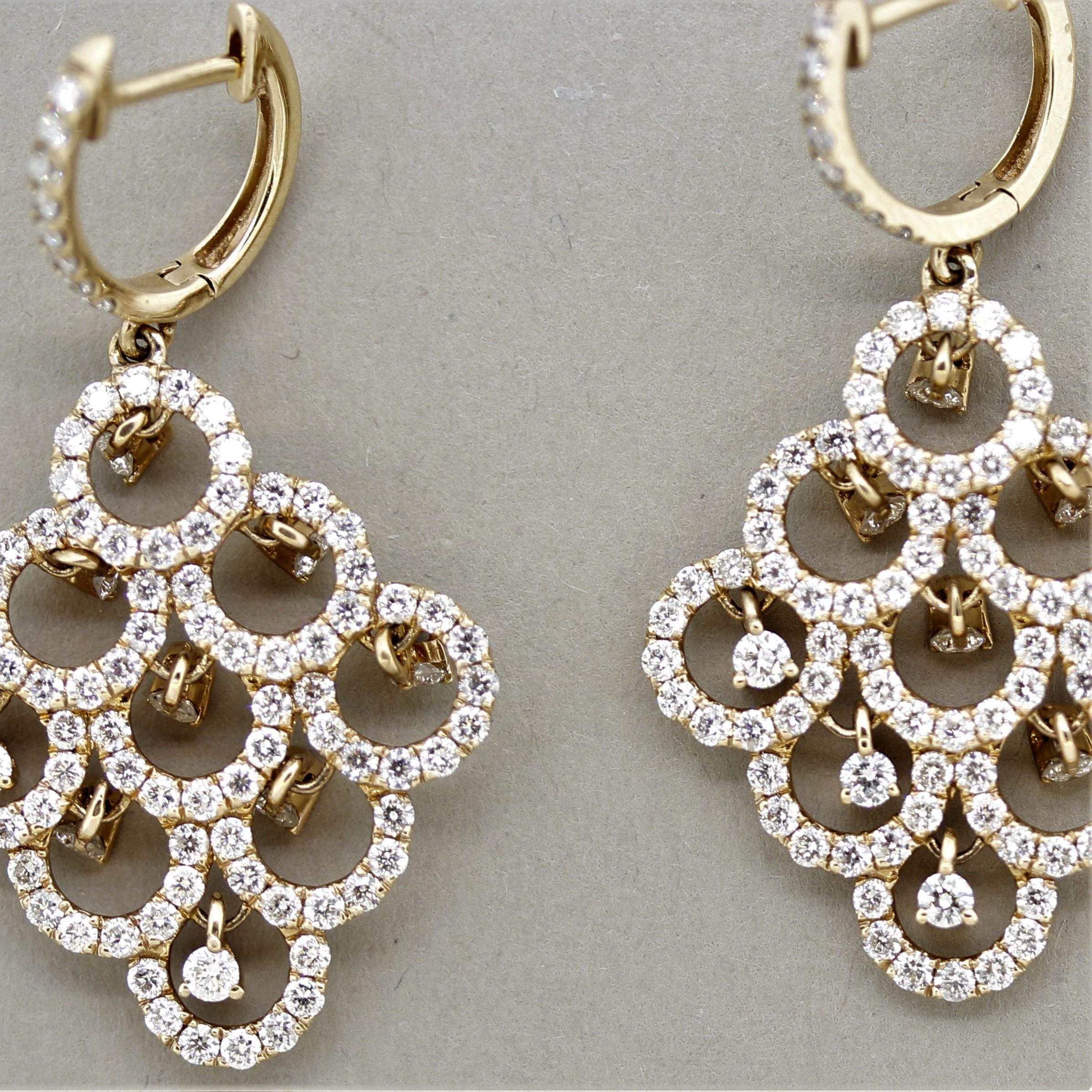 A sweet and stylish pair of diamond chandelier earrings! They feature 3.47 carats of round brilliant-cut diamonds which are set in multiple drops that dangle individually and well as smaller diamonds pave-set around them. Made in 18k rose gold,