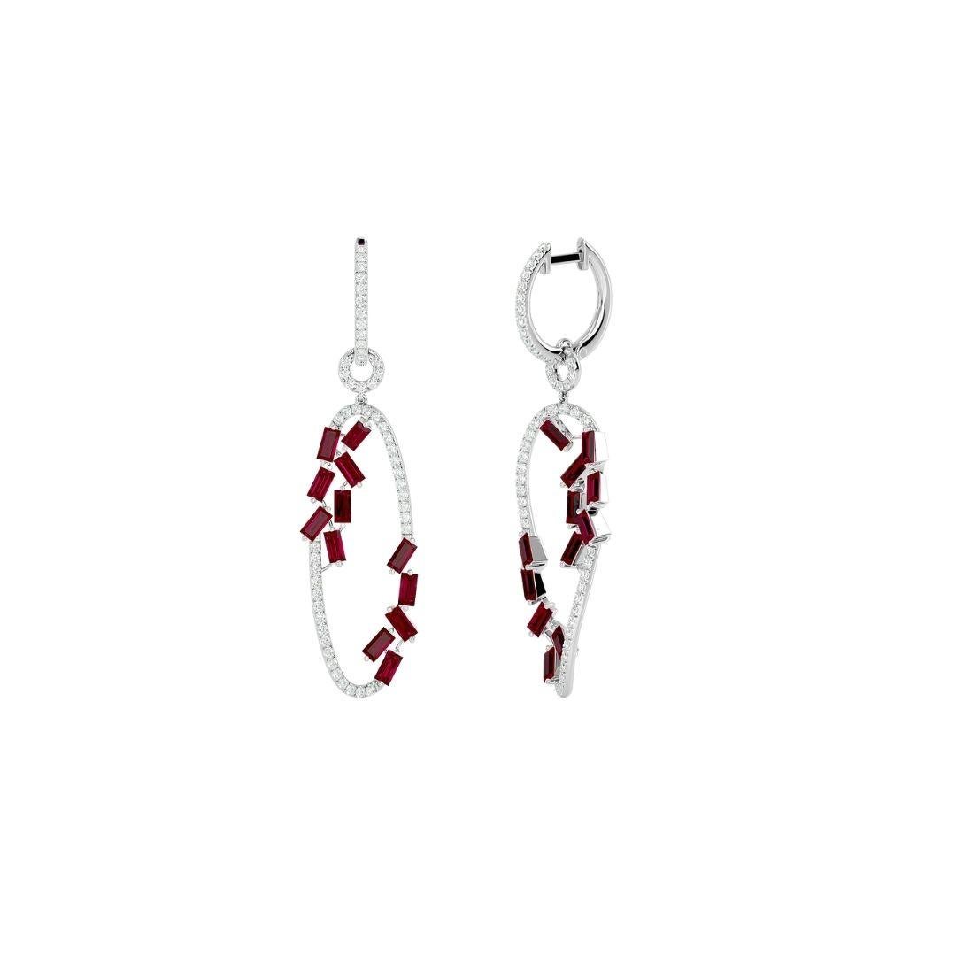 Our Diamond Danglers with Scattered Rubies are a showstopper. These exquisite white diamond danglers are finished with a pop of color from 2.27 ct. baguette rubies, and 0.60 ct. round diamonds set in 18k gold. When everything is put together, the