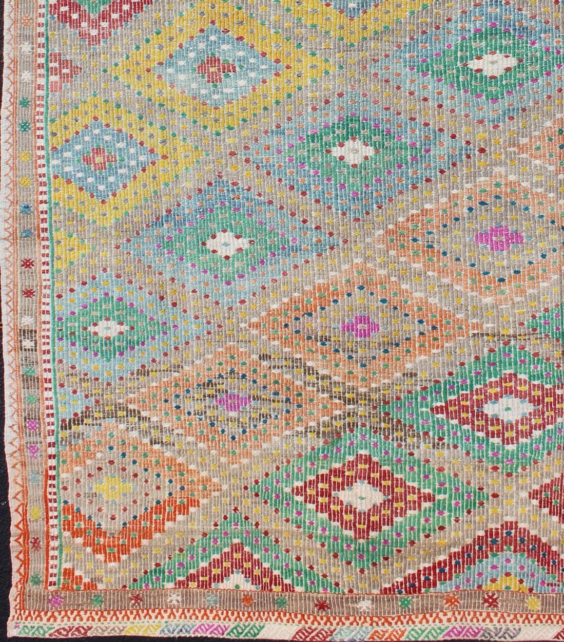 Diamond design Turkish embroidered Kilim vintage rug in Vivid colors
Colorful flat-woven embroidered Kilim rug from Turkey, rug en-179666,
country of origin / type: Turkey / Kilim, circa 1970

This flat-woven Embroidered flat weave rug is