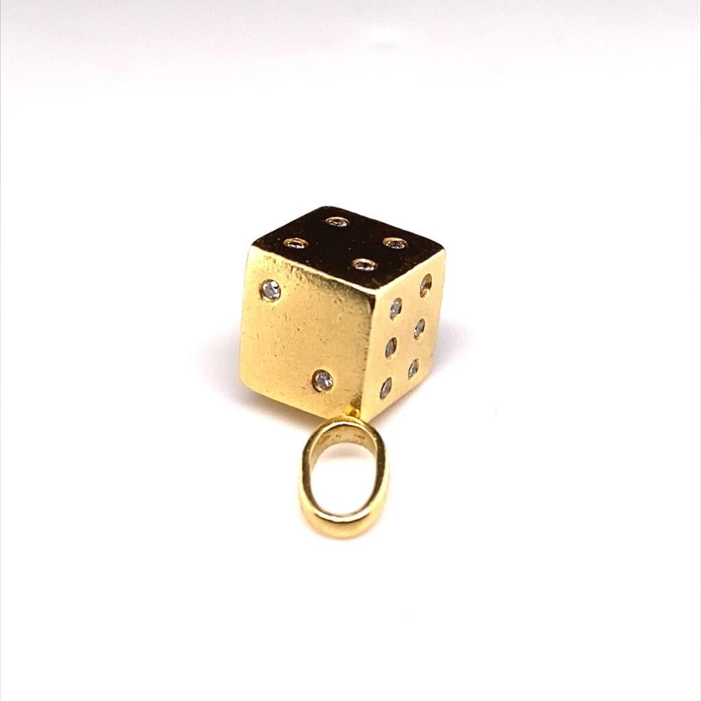 A diamond dice charm in 18 karat yellow gold.

This beautiful retro 18 carat yellow gold charm is created as a miniature diamond set dice to enhance either a bracelet or necklace.

Featuring round brilliant cut diamonds for total of 0.21 carats and