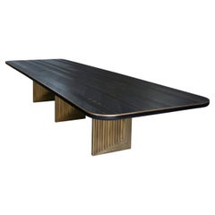 "Diamond" dining table made of French Oak tinted black and oxidized brass legs
