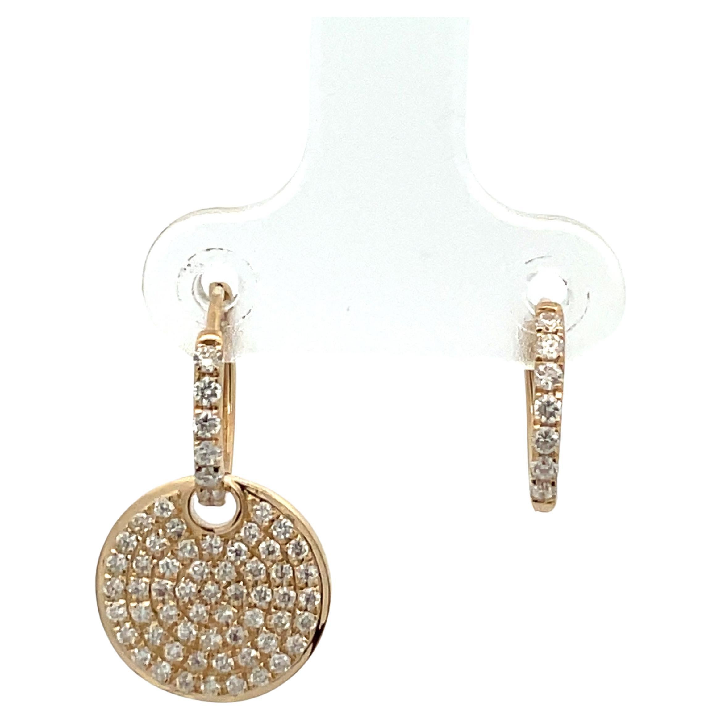 14 Karat yellow gold drop earrings featuring 126 round brilliants weighing 0.89 carats. The diamond disc can be removed to wear as just a diamond huggie hoop. 