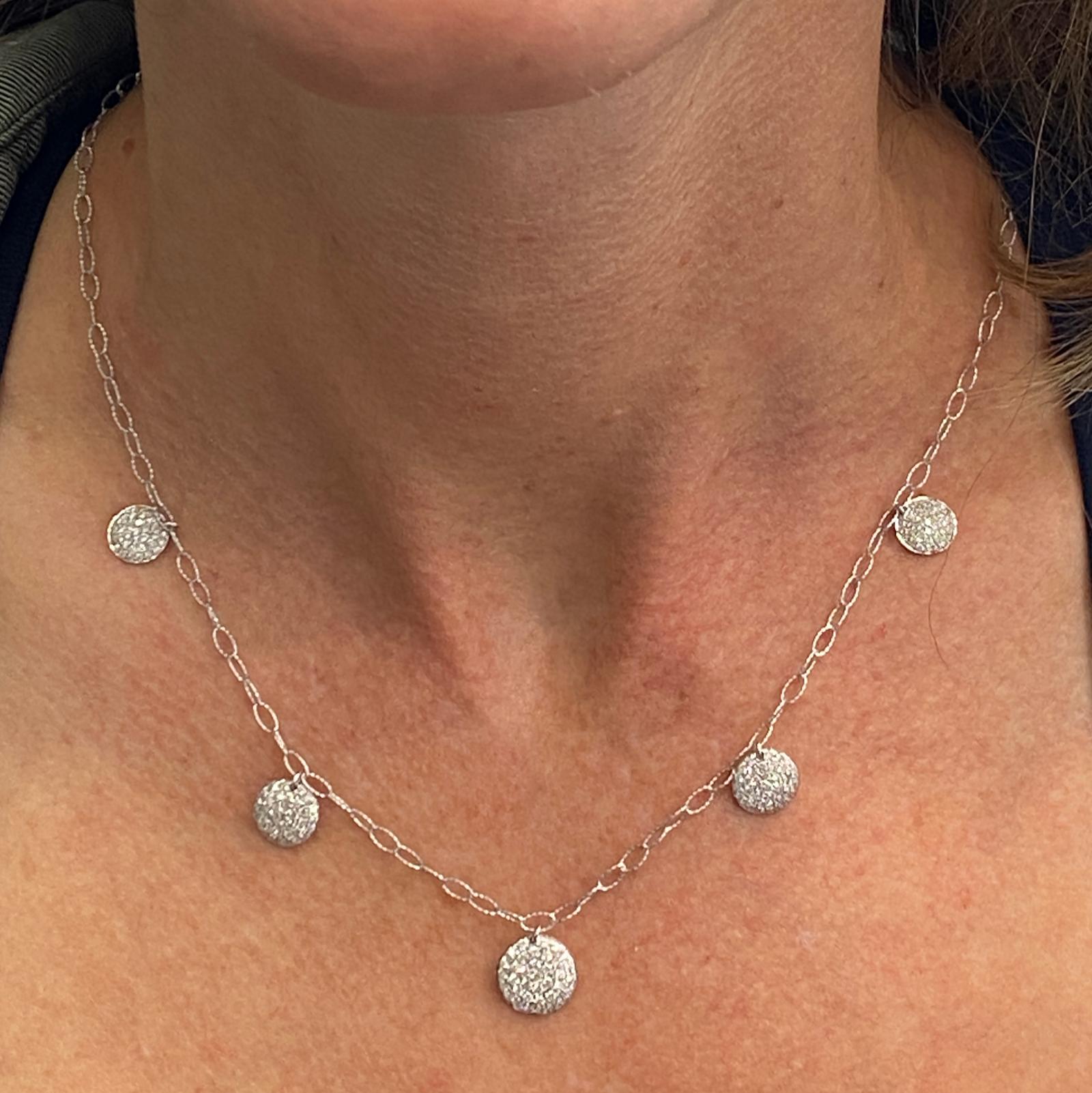 Beautiful modern diamond drop necklace fashioned in 14 karat white gold. The drop disk necklace features round brilliant cut diamonds weighing approximately 1.75 carat total weight and graded H-I color and SI clarity. The link necklace measures 18