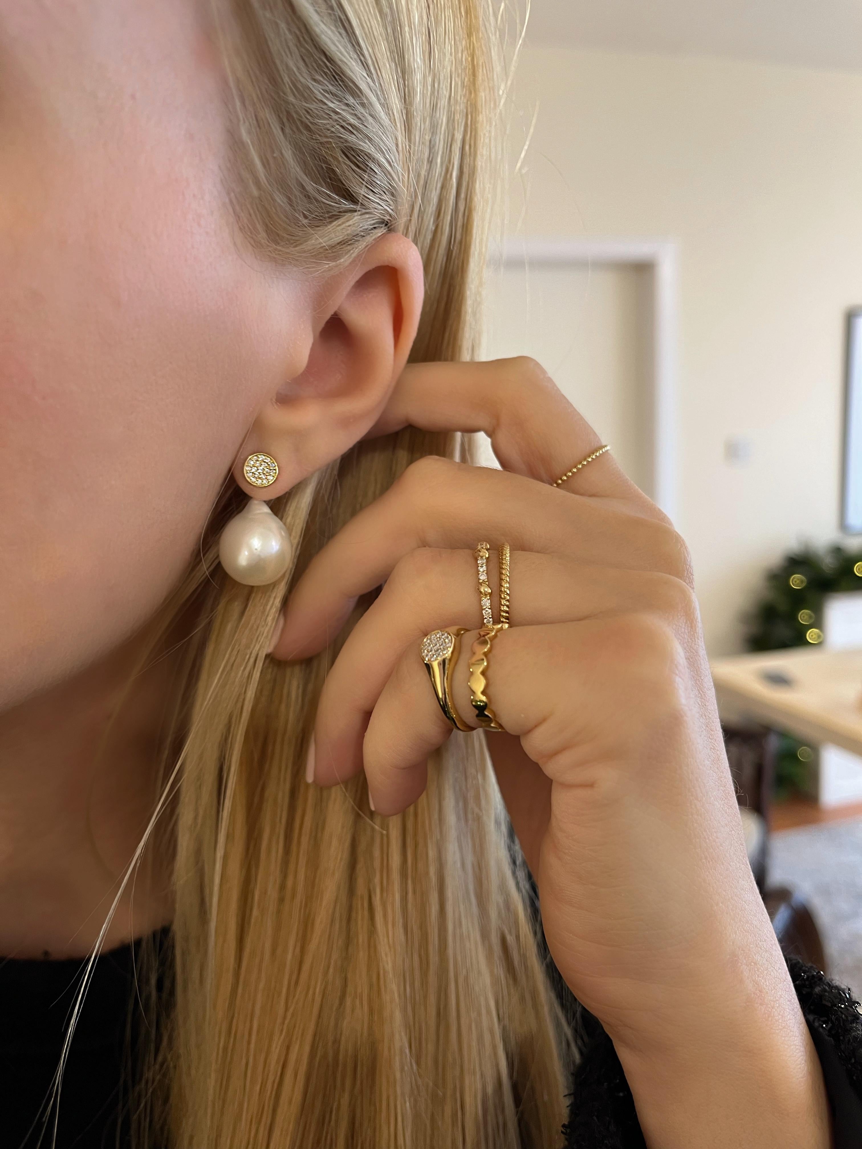 Our ‘Diamond Disk Earrings’ by Michelle Massoura feature a pair of glimmering diamond disks (width 7mm), set in 18Karat Gold and detachable baroque pearls. The diamond disk studs can be worn on their own as the perfect everyday luxury stud earring,