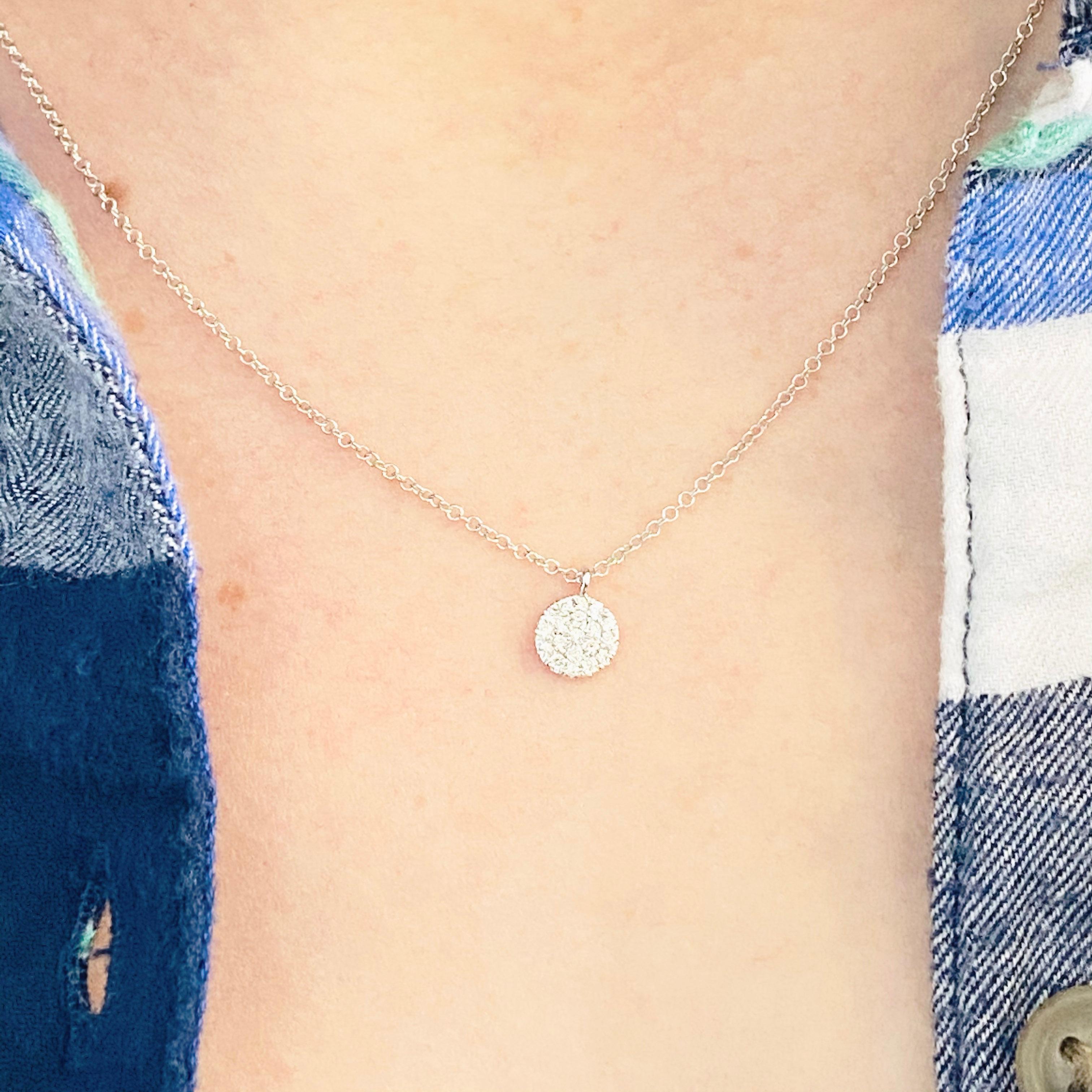This gorgeous 14k white gold disk pendant with pave diamonds is sure to put a smile on anyone's face! This necklace looks beautiful worn by itself and also looks wonderful in a necklace stack. This necklace would make a wonderful gift for your loved