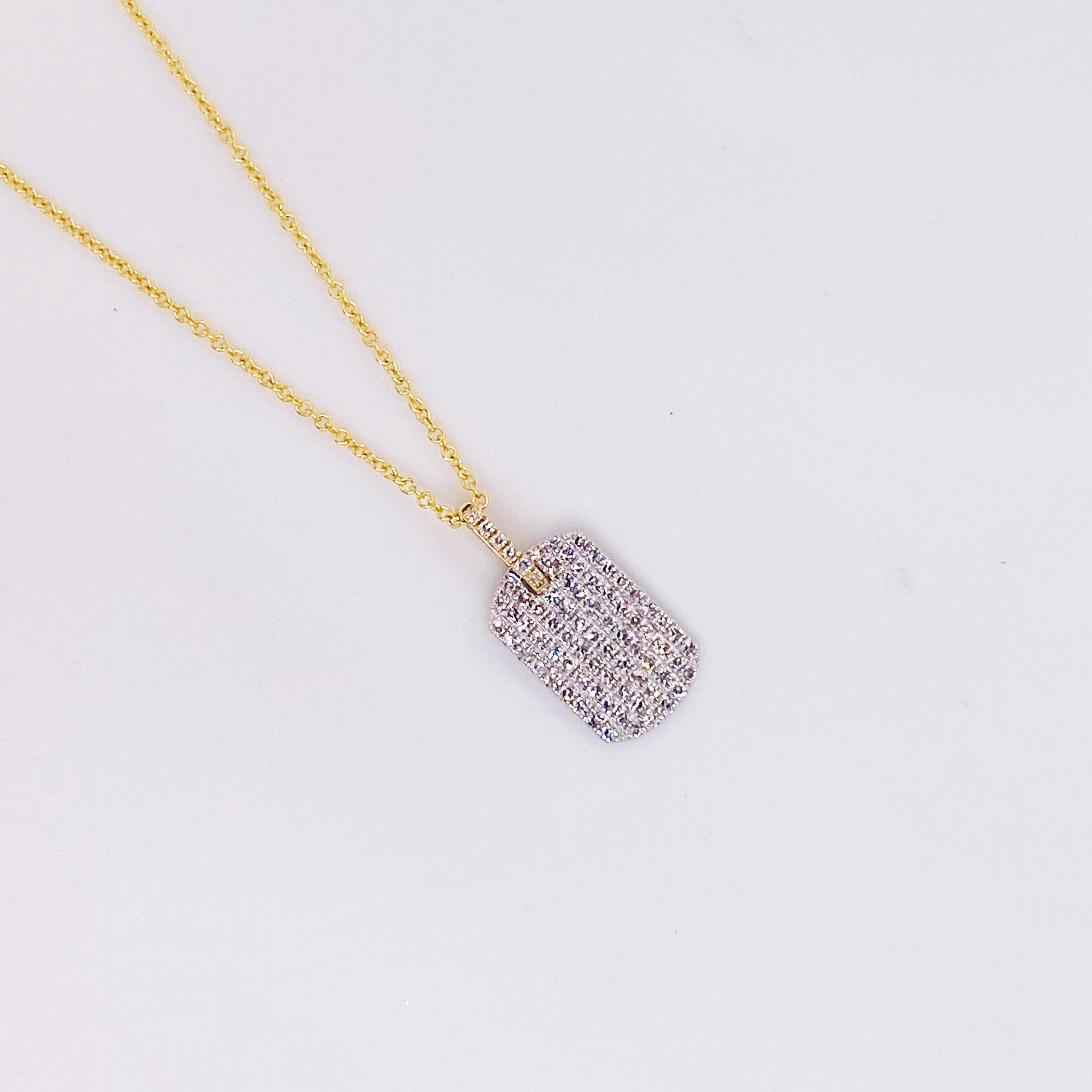 This dog tag pendant has solid 77 diamonds that are pave set. Pave means paved in French and this dog tag is definitely paved with diamonds. It is a lovely pendant alone or layered with other chains and pendants. This necklace can help create a