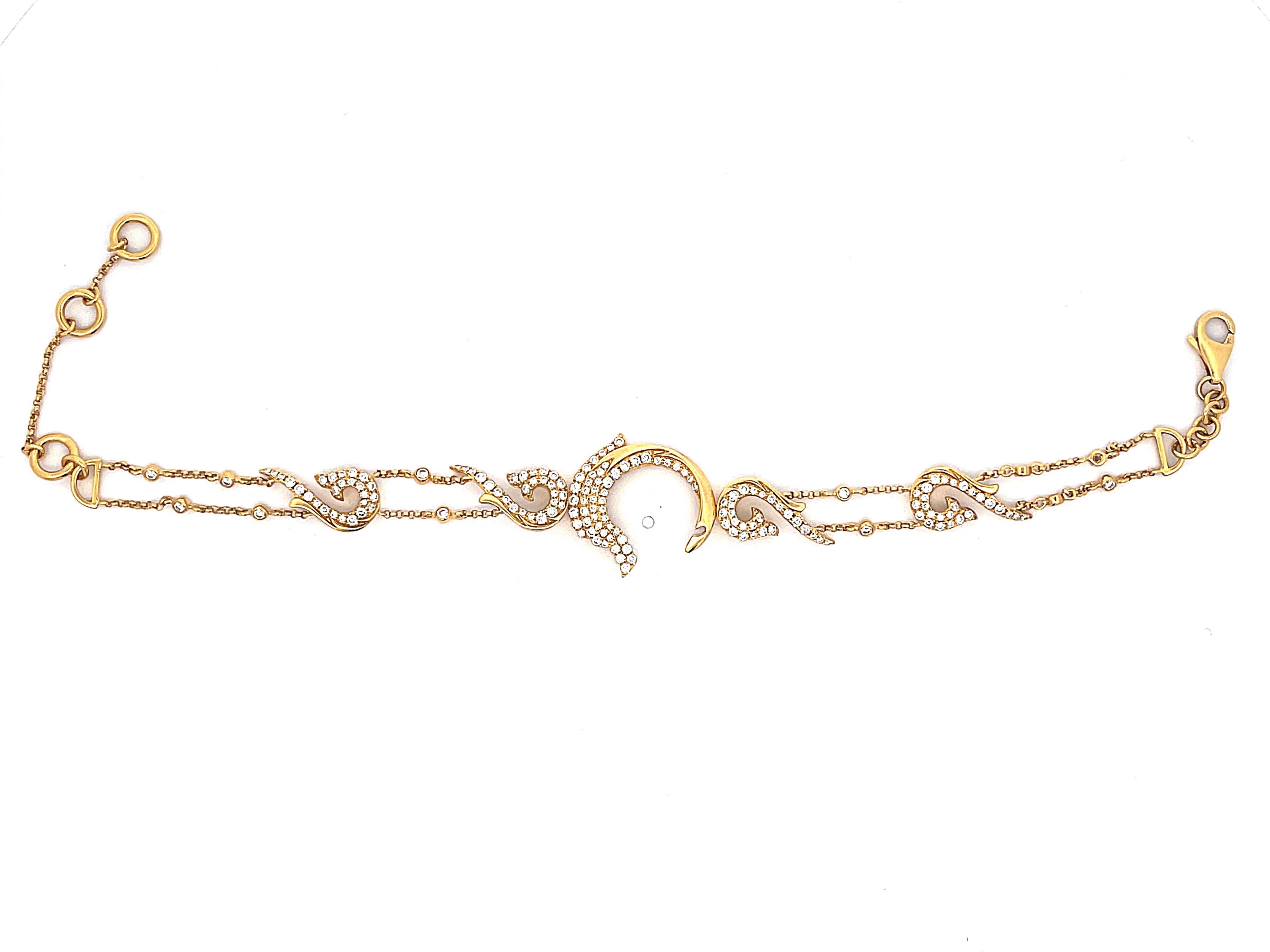 Bracelet de dauphins en or jaune 18 carats et diamants Excellent état - En vente à Honolulu, HI