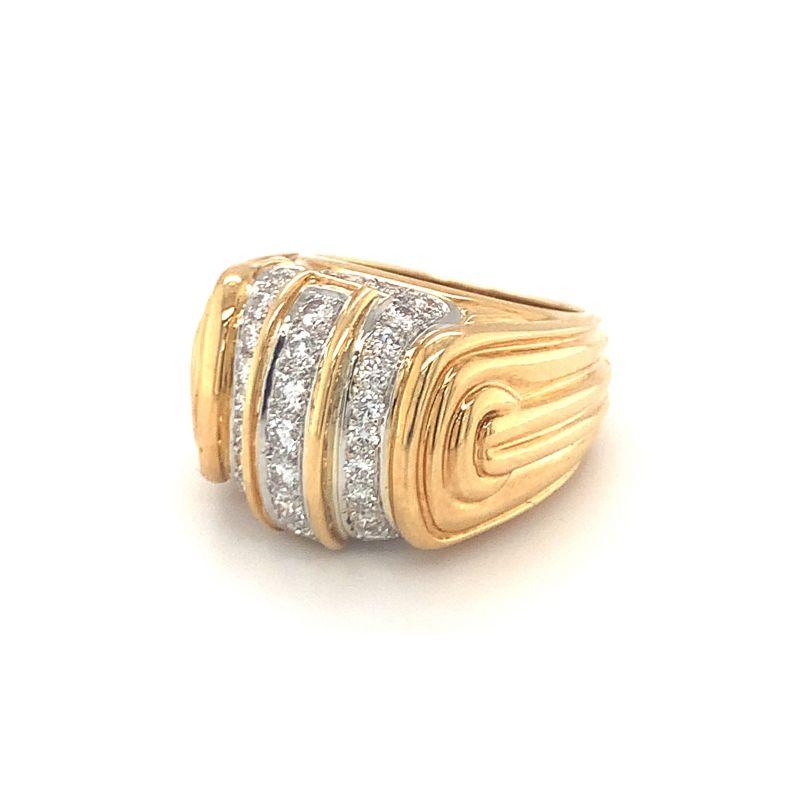 One diamond dome 18K yellow gold and platinum ring featuring 35 round cut diamonds weighing approximately 1.30 ct. with F-G color and VS-1 clarity. With fluted and ribbed designer mount.

Substantial, fantastic, superb.

Additional