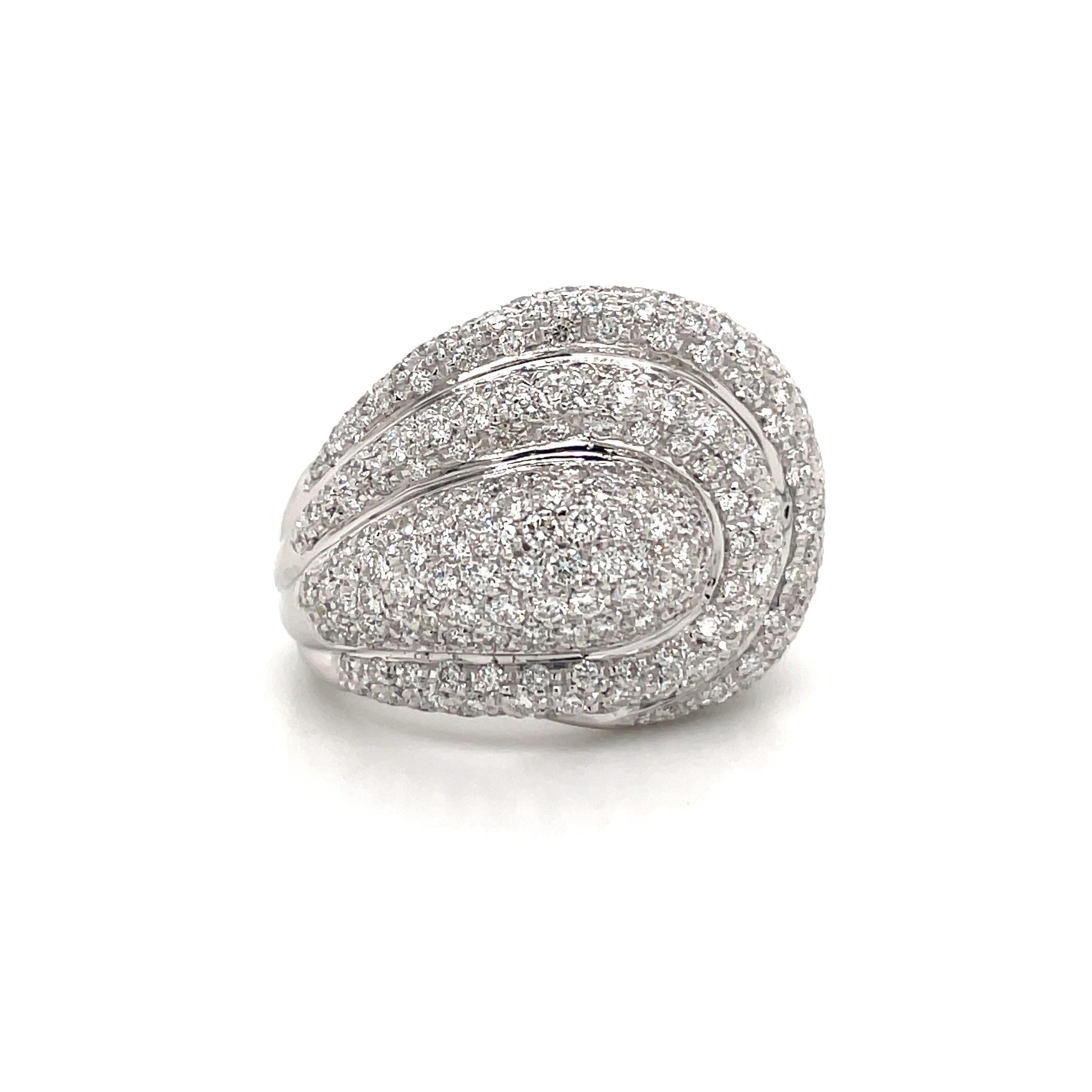 Chic dome cocktail ring featuring 268 round brilliants weighing 4 carats, crafted in 18k white gold. 
Color F-G
Clarity VS2
Size 7.5, sizeable
 