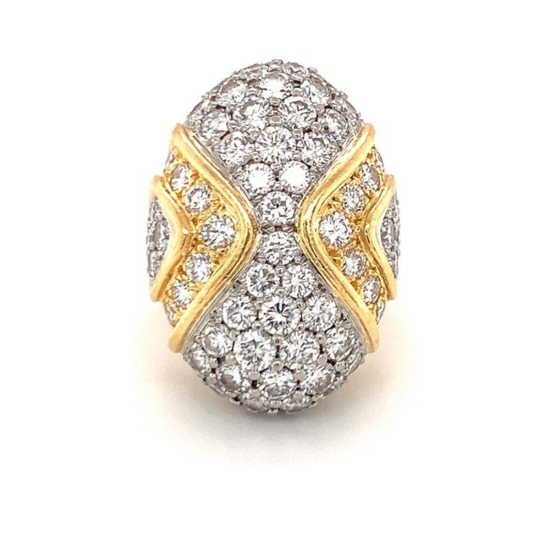 Oval-shaped diamond dome ring exquisitely designed in platinum and 18K yellow gold featuring 82 pave set, round brilliant cut diamonds totaling 5 ct. with G color and VS-1 clarity. Bold, enchanting, brilliant.

Additional information:
Metal: