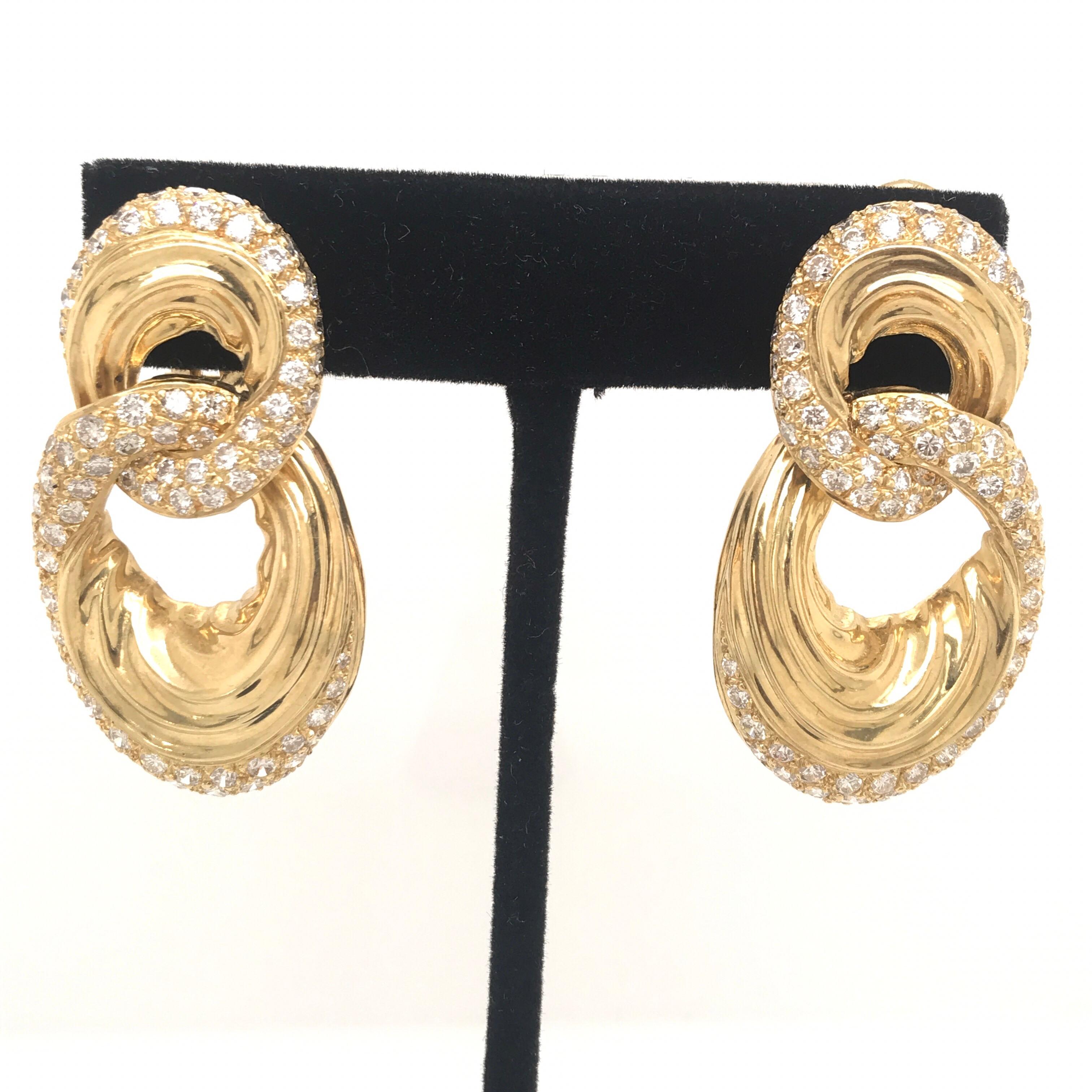18K Yellow Gold door knocker earrings featuring round brilliants weighing 6.92 carats. Very chic!! 
Color H
Clarity SI