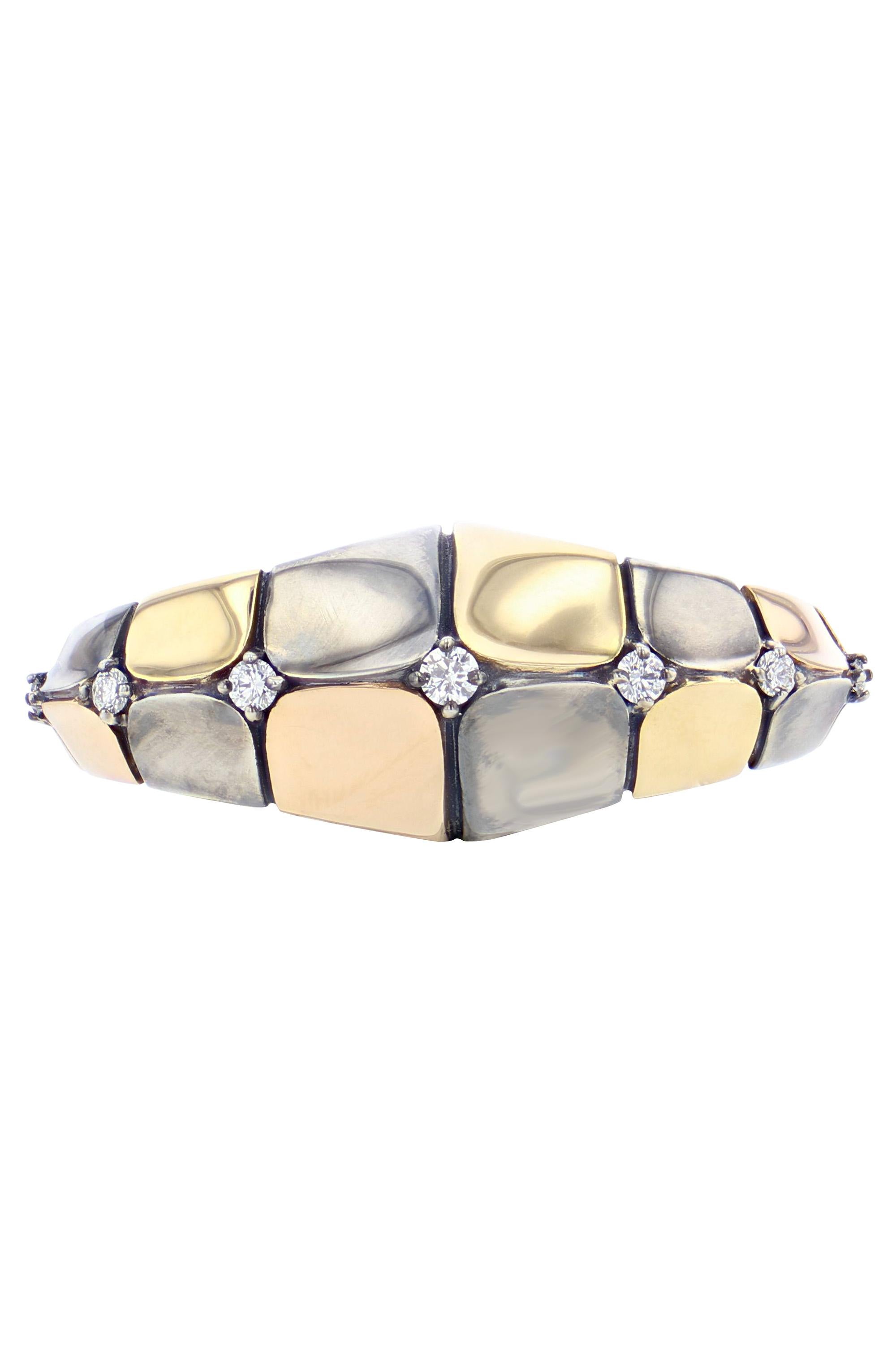 Yellow gold and distressed silver ring with yellow gold, rose gold or distressed silver scales, set with diamonds.

Details:
9 Diamonds: 0.34 cts
18k Yellow Gold & Rose Gold: 7.5 g
Distressed Silver: 7 g
Made in France