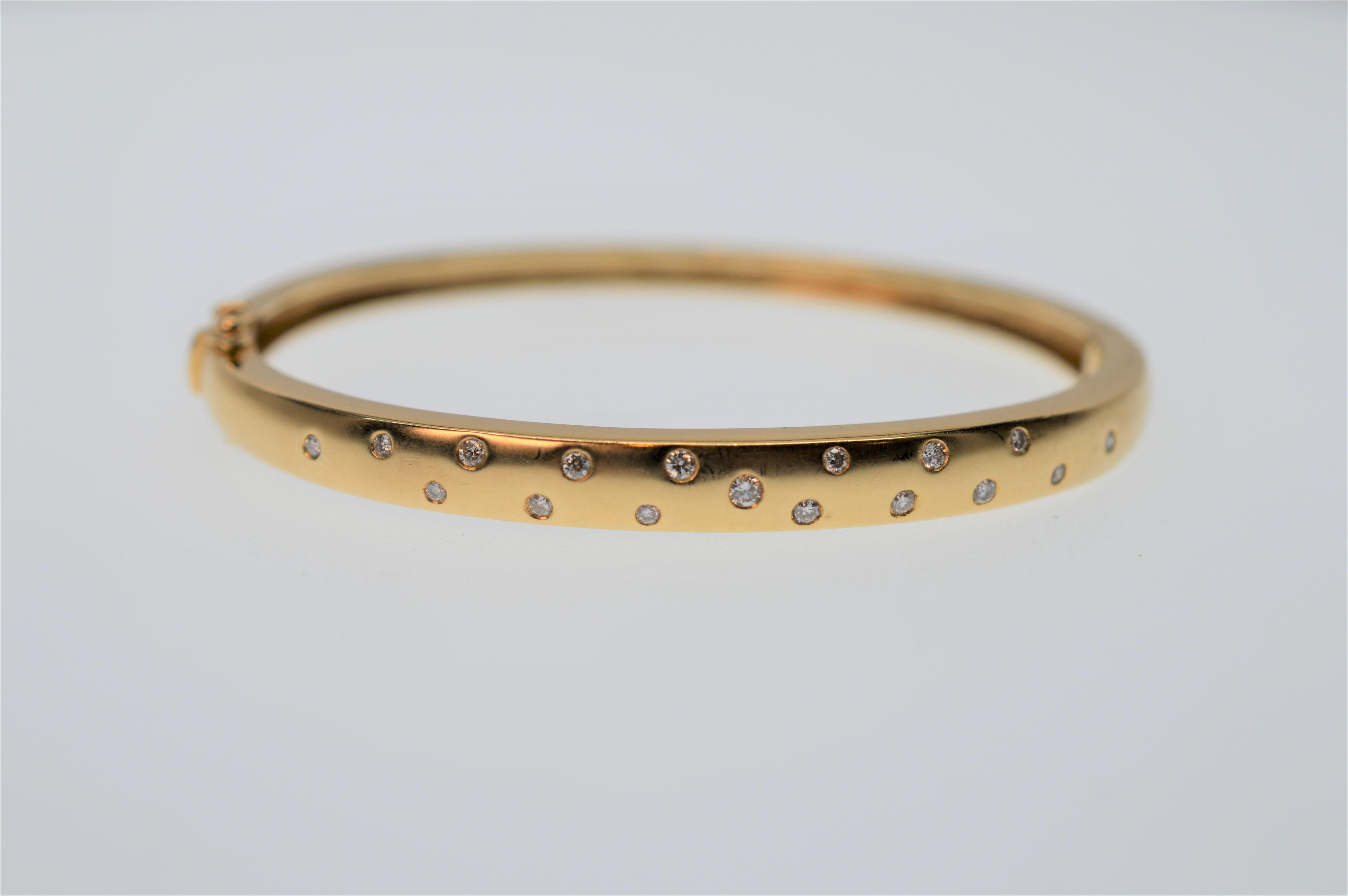 Fun and versatile, this Diamond Dot 14K Yellow Gold Bangle Bracelet with matching Diamond Dot 14K Gold Hoop Huggie Pierced Earrings is appropriate for all ages and occasions. From the Susan VanGilder Estate Collection, this suite, dotted with .25
