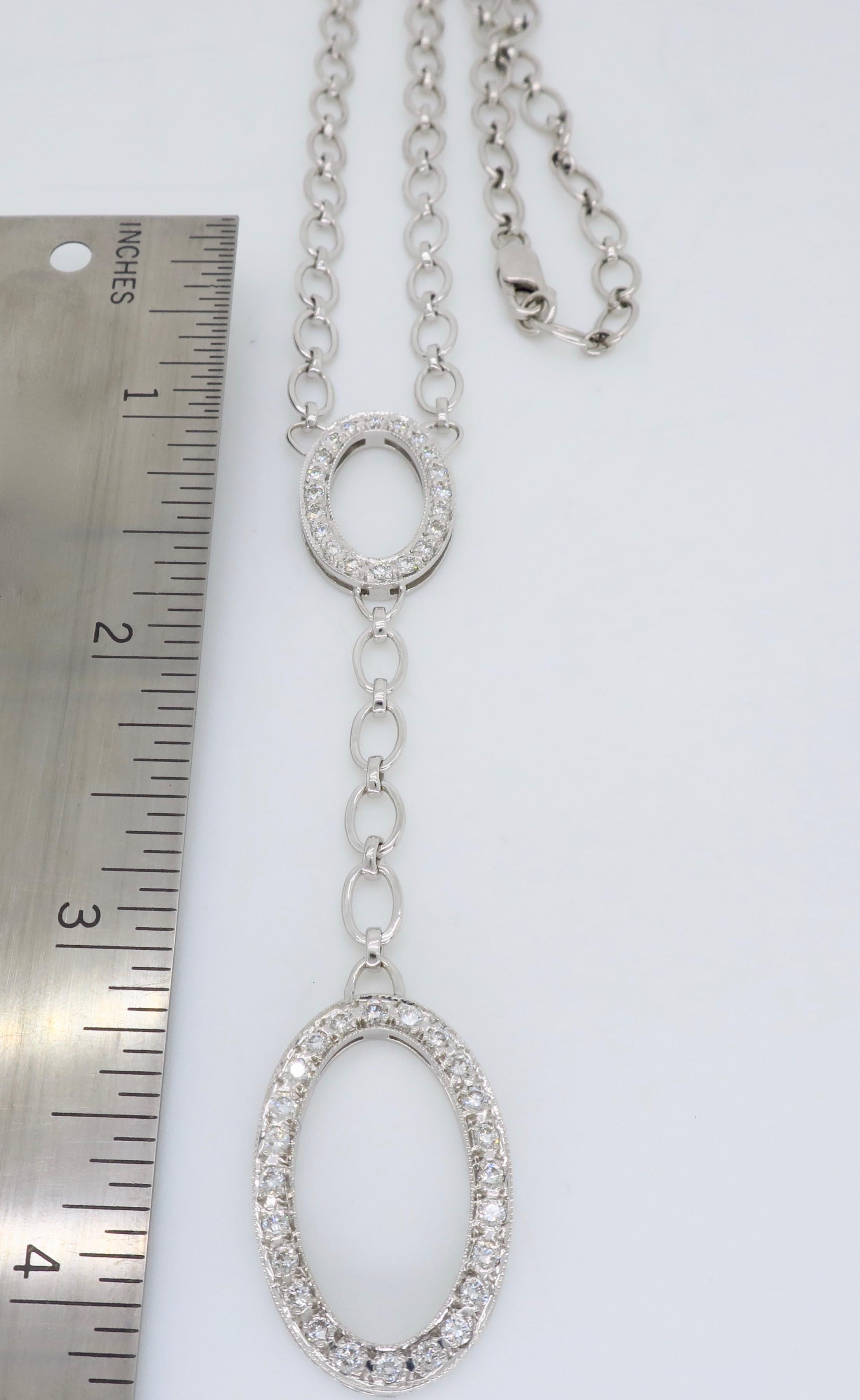 Approximately 1.30CTW diamond oval drop necklace crafted in 18k white gold. 

Diamond Carat Weight: Approximately 1.30CTW
Diamond Cut: Round Brilliant Cut
Color: Average G-I
Clarity: Average VS
Metal: 18K White Gold
Approximate Drop Length: 3 3/16”