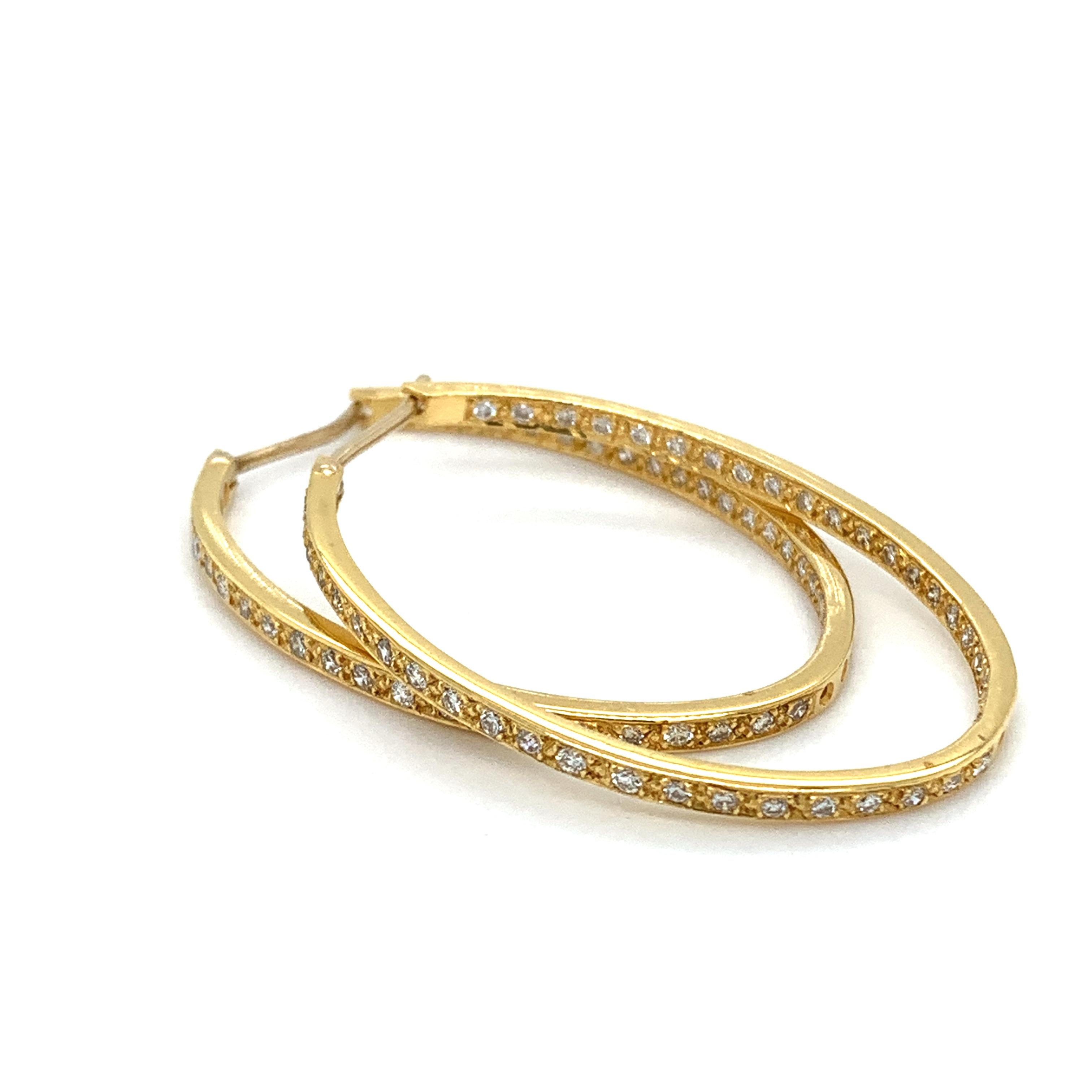 Diamond double side large hoop earrings 18k yellow gold
Round brilliant diamond cut total weight 1.68ct F colour VS1 clarity double side diamond hoop earrings in 18k yellow gold
Width of the hoop earrings approximately 2mm
Diameter of the hoops
