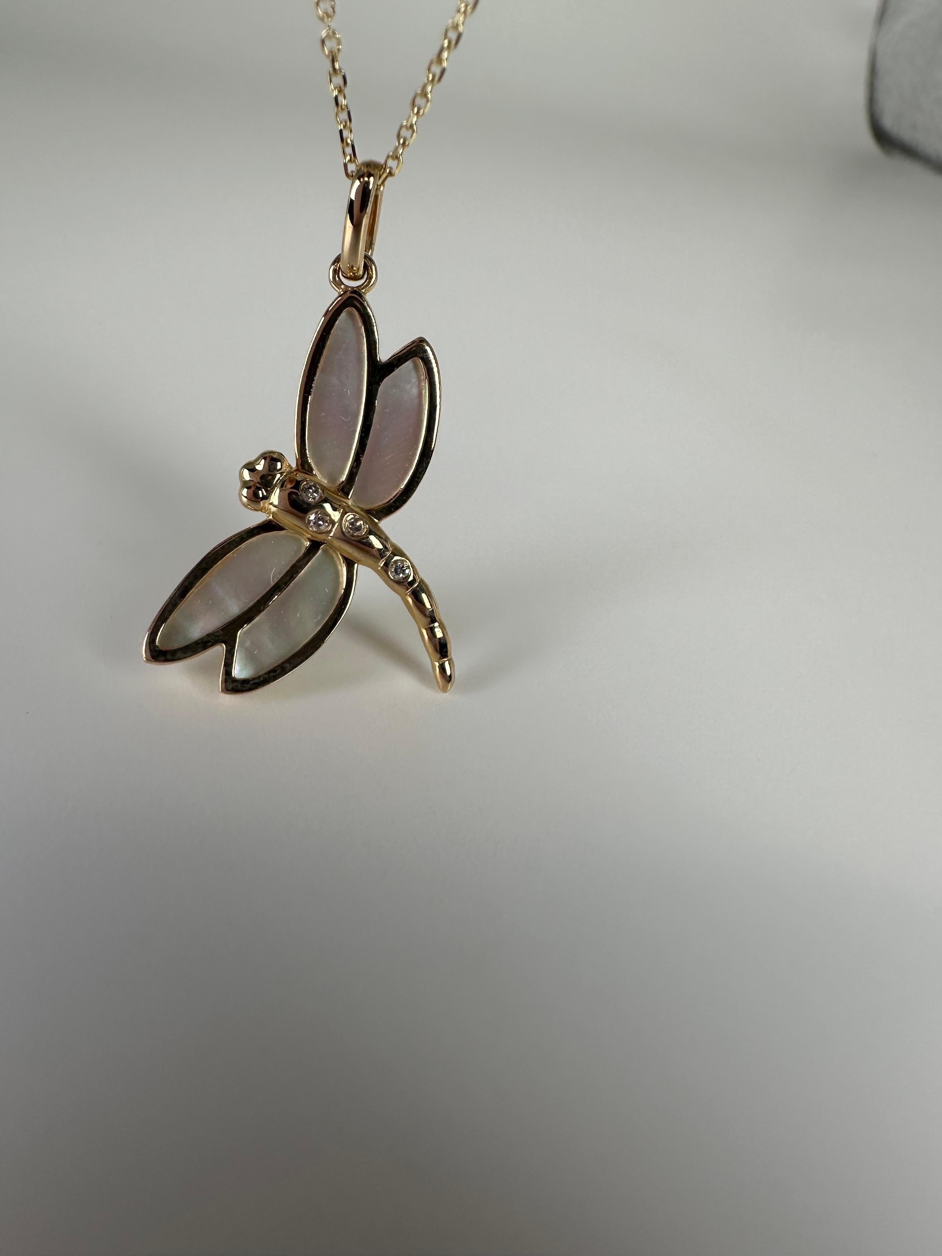 Stunning dragonfly in 14Kt gold made with diamonds and enamel art! Chain is 18