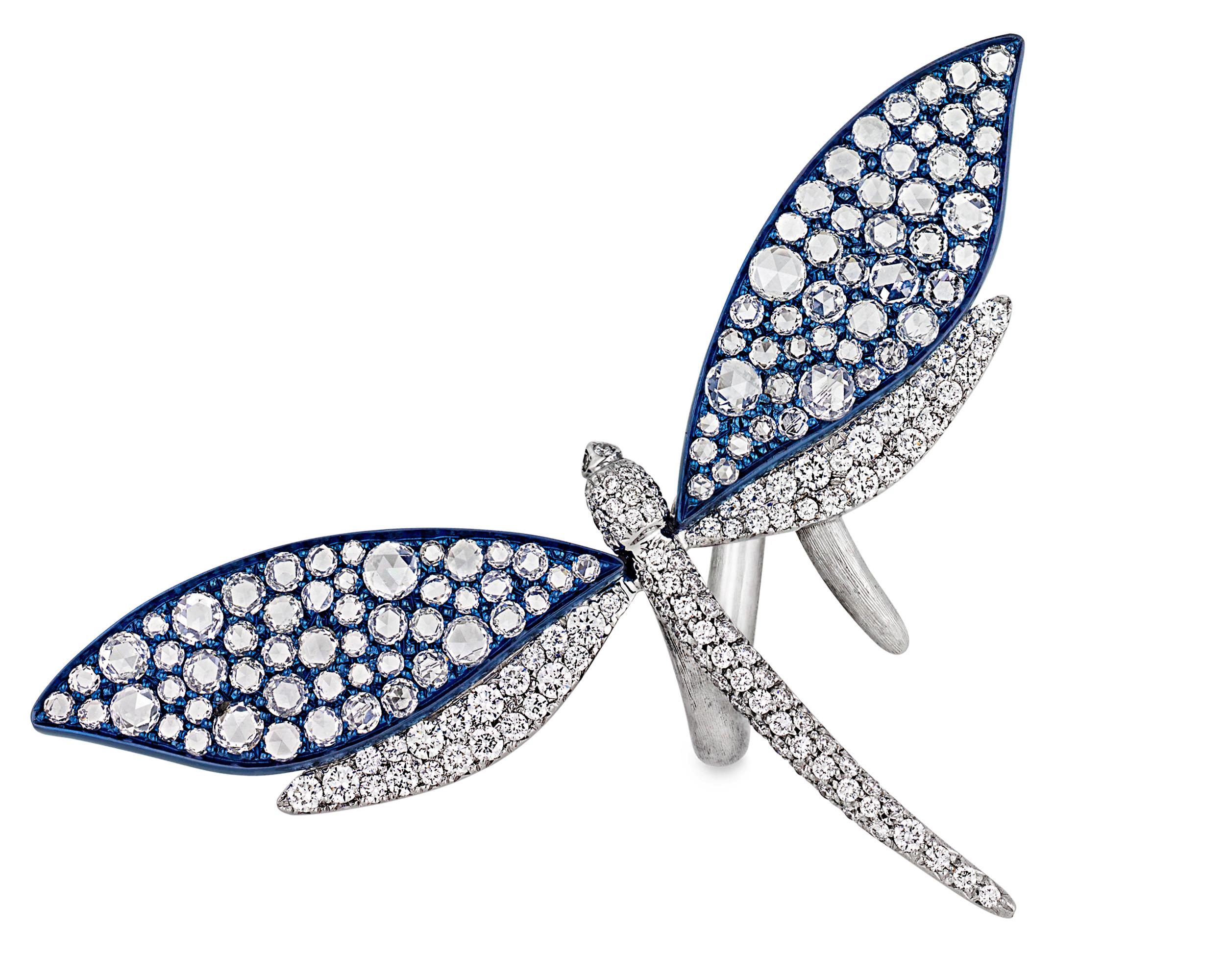 A diamond-encrusted dragonfly is the subject of this imaginative 18K white gold and titanium ring. Sparkling diamonds totaling 3.81 carats cover the dragonfly's body and wings while the band is finely etched to resemble a tree branch, enhancing the