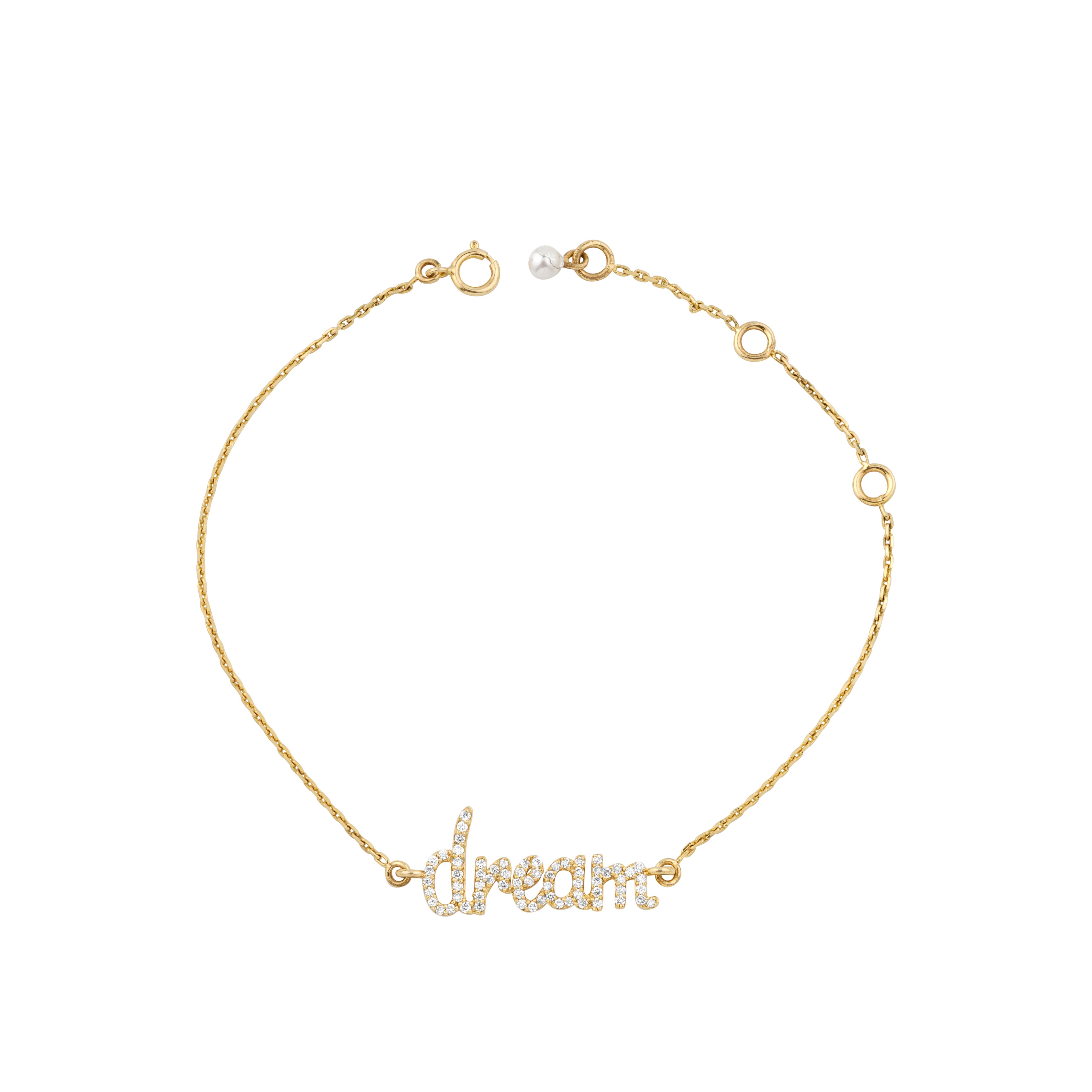 Diamond Dream Charm Bracelet features a delicate gold-tone bracelet with the word 