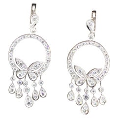 Boucles d'oreilles papillon en or blanc 18k avec pendentifs et diamants