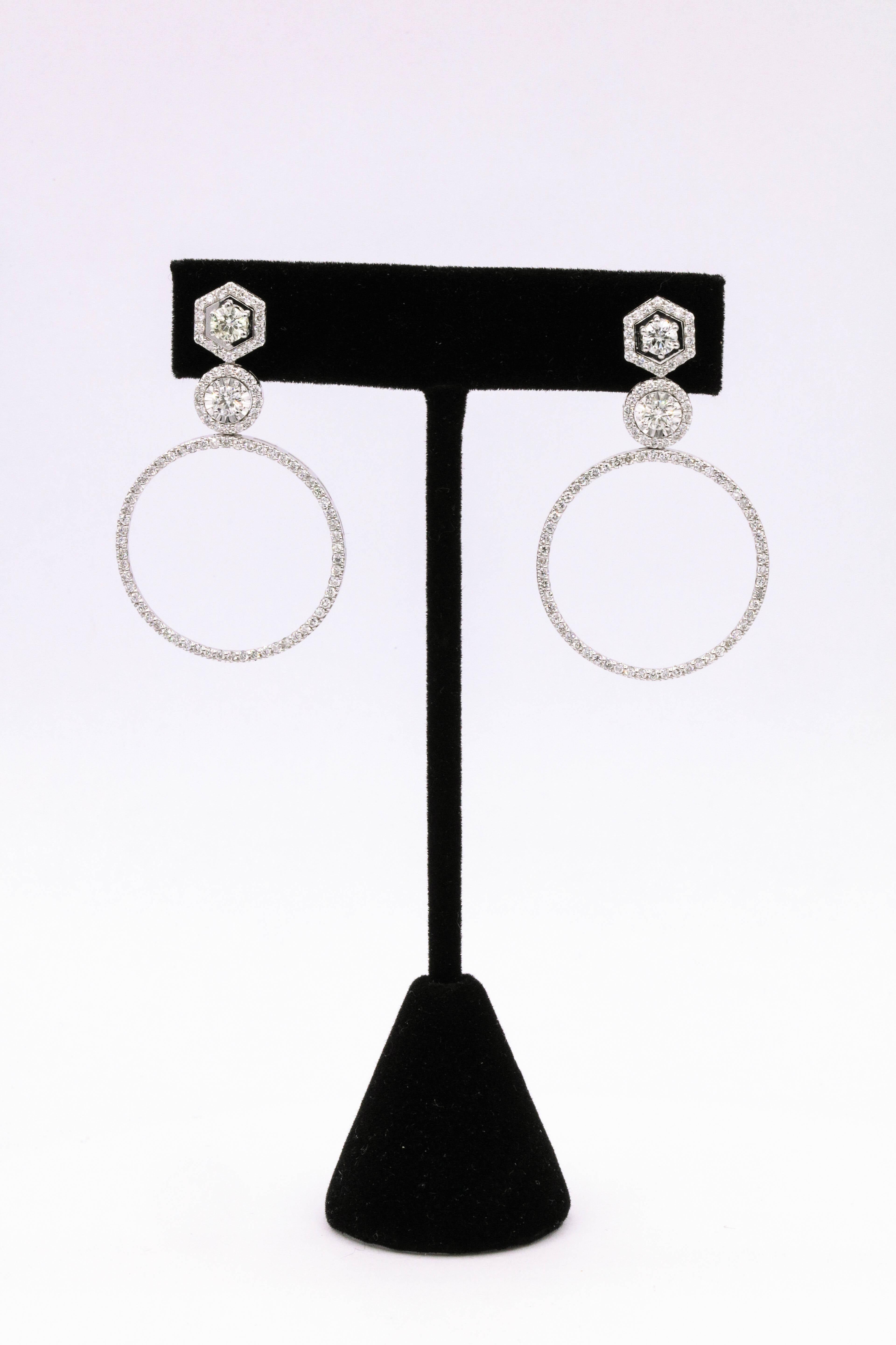 14K White gold drop earrings featuring 188 round brilliants weighing 2.52 carats.
Color G-H
Clarity SI