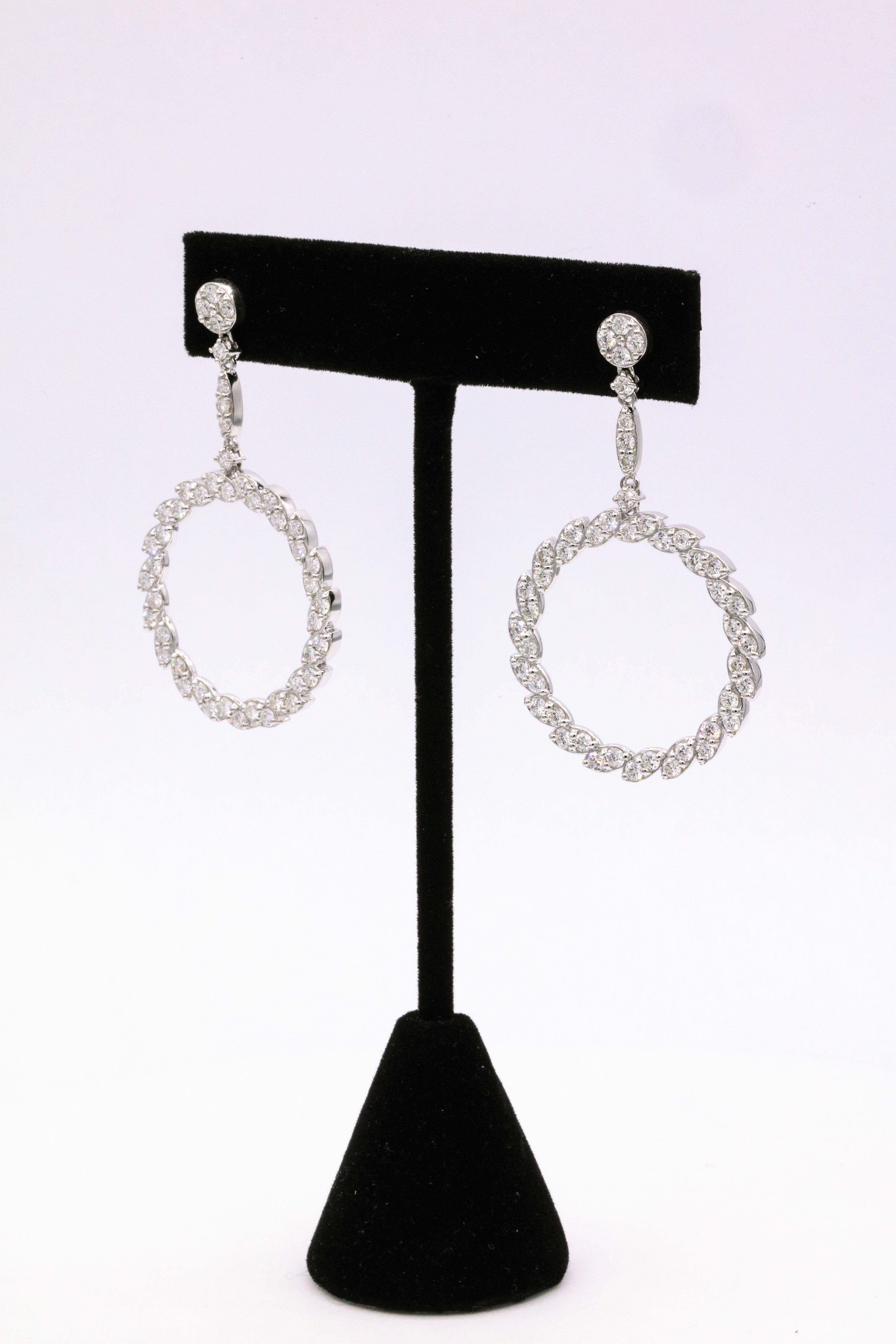 14K White gold drop earrings featuring 94 round brilliants weighing 3.75 carats.
Color G-H
Clarity SI