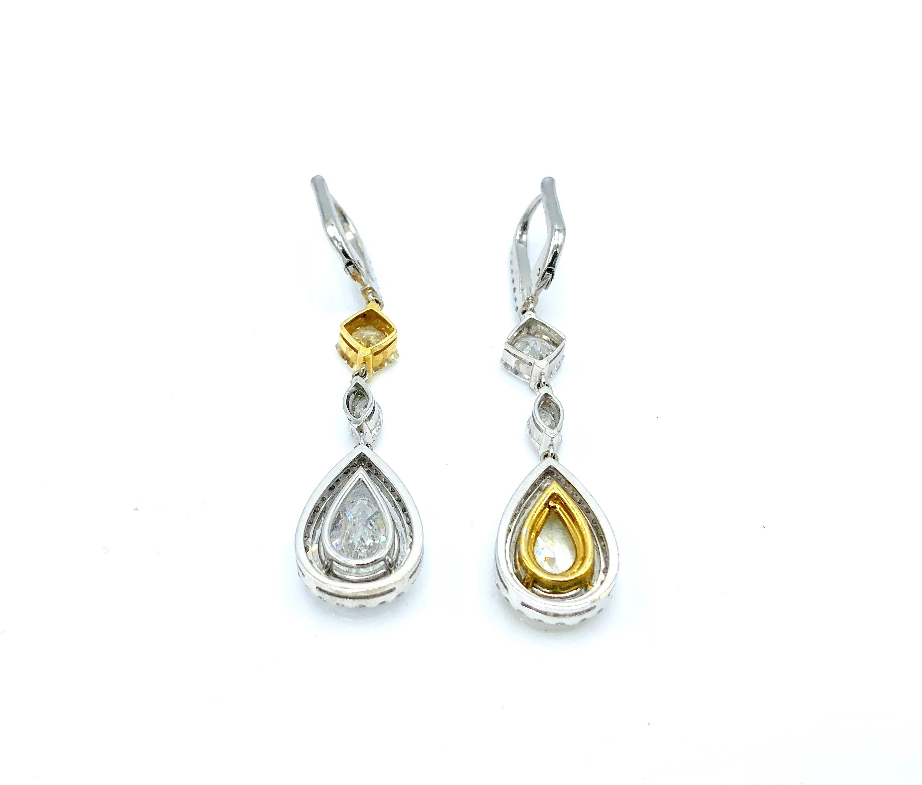 A pair of important earrings featuring 2 pear shape diamonds (1 fancy yellow)

2 Pear shape Diamonds: 6.44ct
2 Marquise Diamonds: 0.60 ct
2 Emerald cut diamonds: 1.87 ct