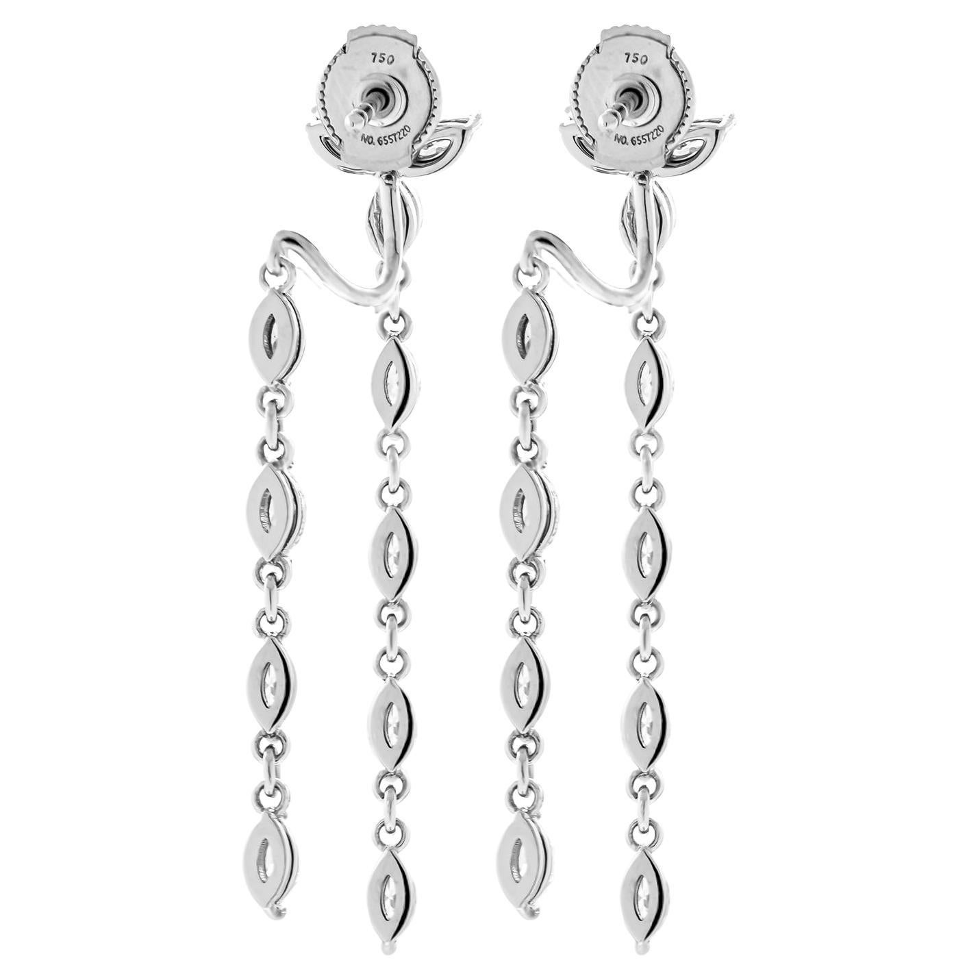 Drop earrings in 18K White Gold 
2 Round Diamonds 4.4mm each -0.66CT
22 Marquee diamonds total carat weight: 3.24ct

Comes in a box, appraisal available upon request.
Retail Value: 25,000.00$