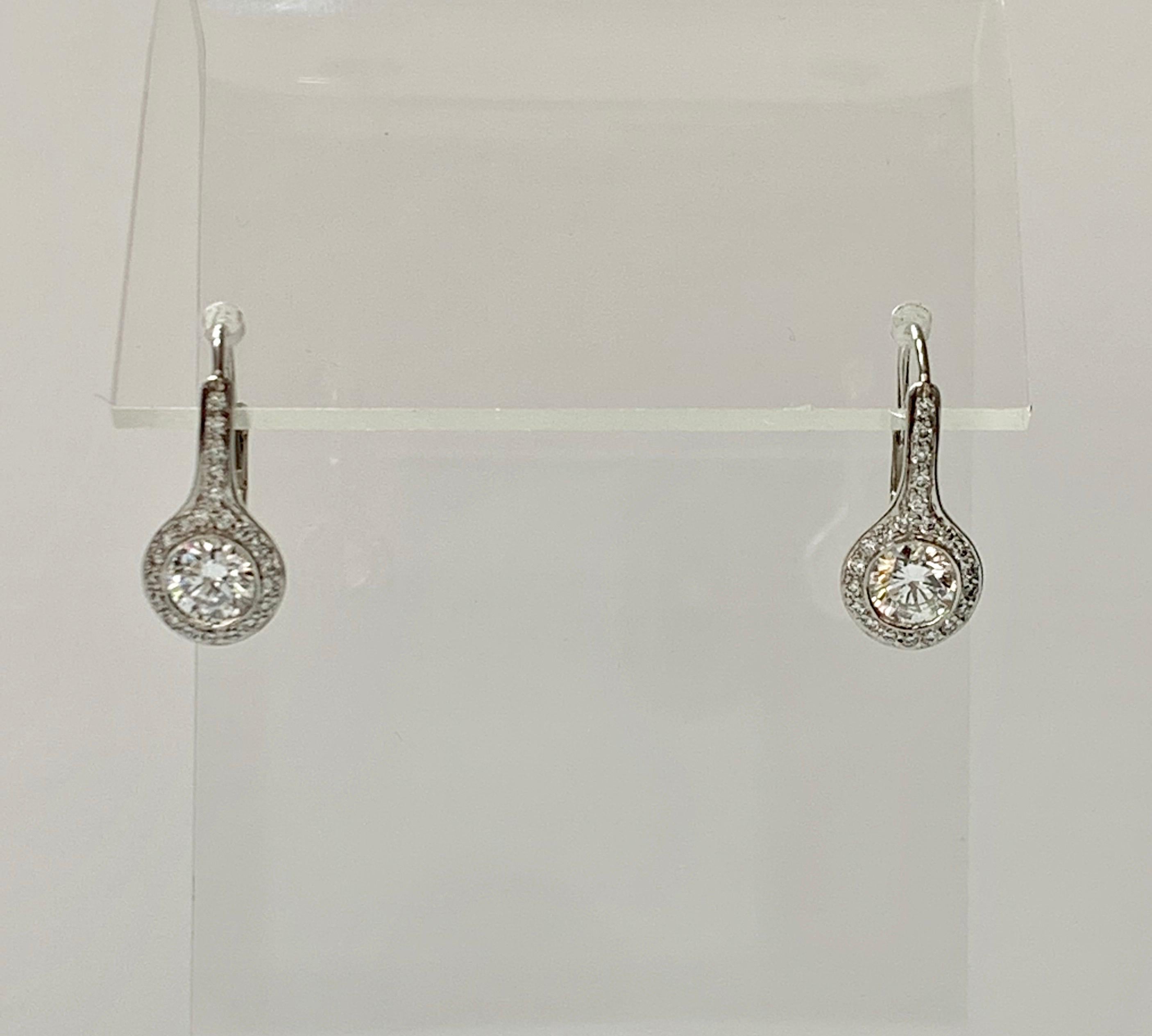 Round Cut Diamond Drop Earrings in Platinum For Sale