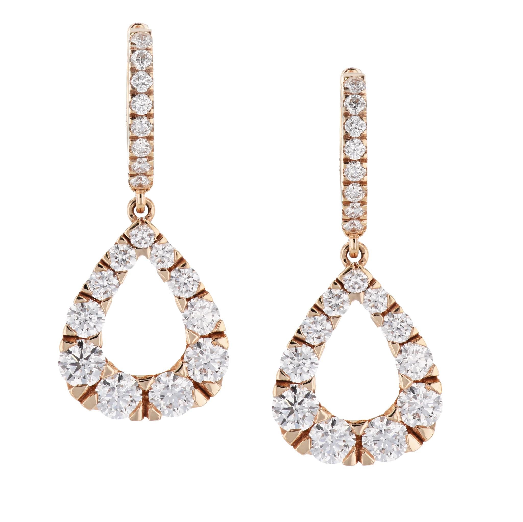 Glimmer with diamonds, in these 18 karat rose gold hoop drop earrings! They are a must have for any fine jewelry collector.
Indulge yourself or a loved one with these stunningly sophisticated and elegant earrings. 

They measure 29 mm long and 7 mm