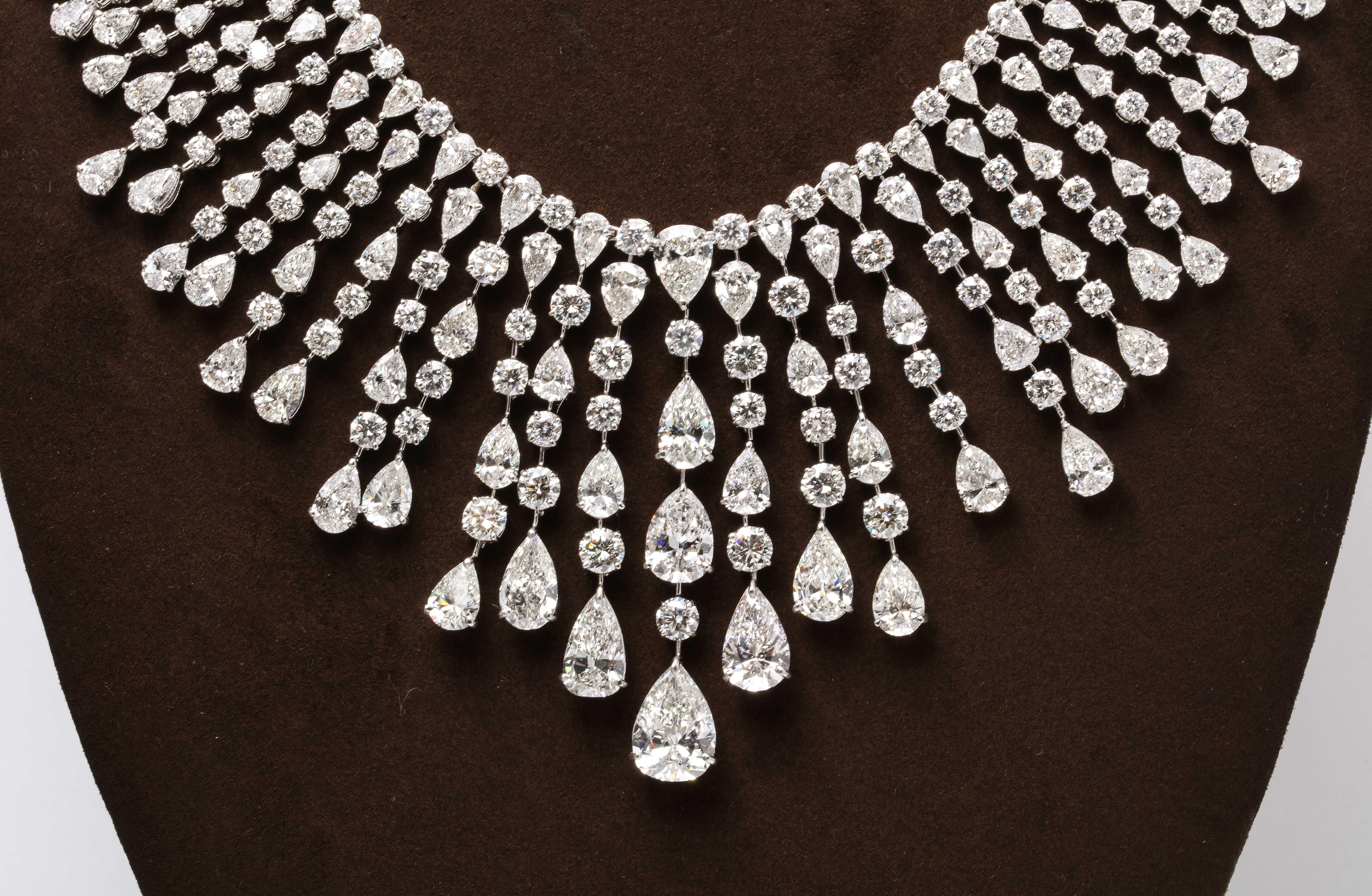 
A MASTERPIECE

This important diamond necklace features over 128 carats of white pear shape and round diamonds. 

This piece is made up of many diamonds above 1 carat up to the 5 carat pear shaped drop. 
The center line drop features 2, 3, and 5