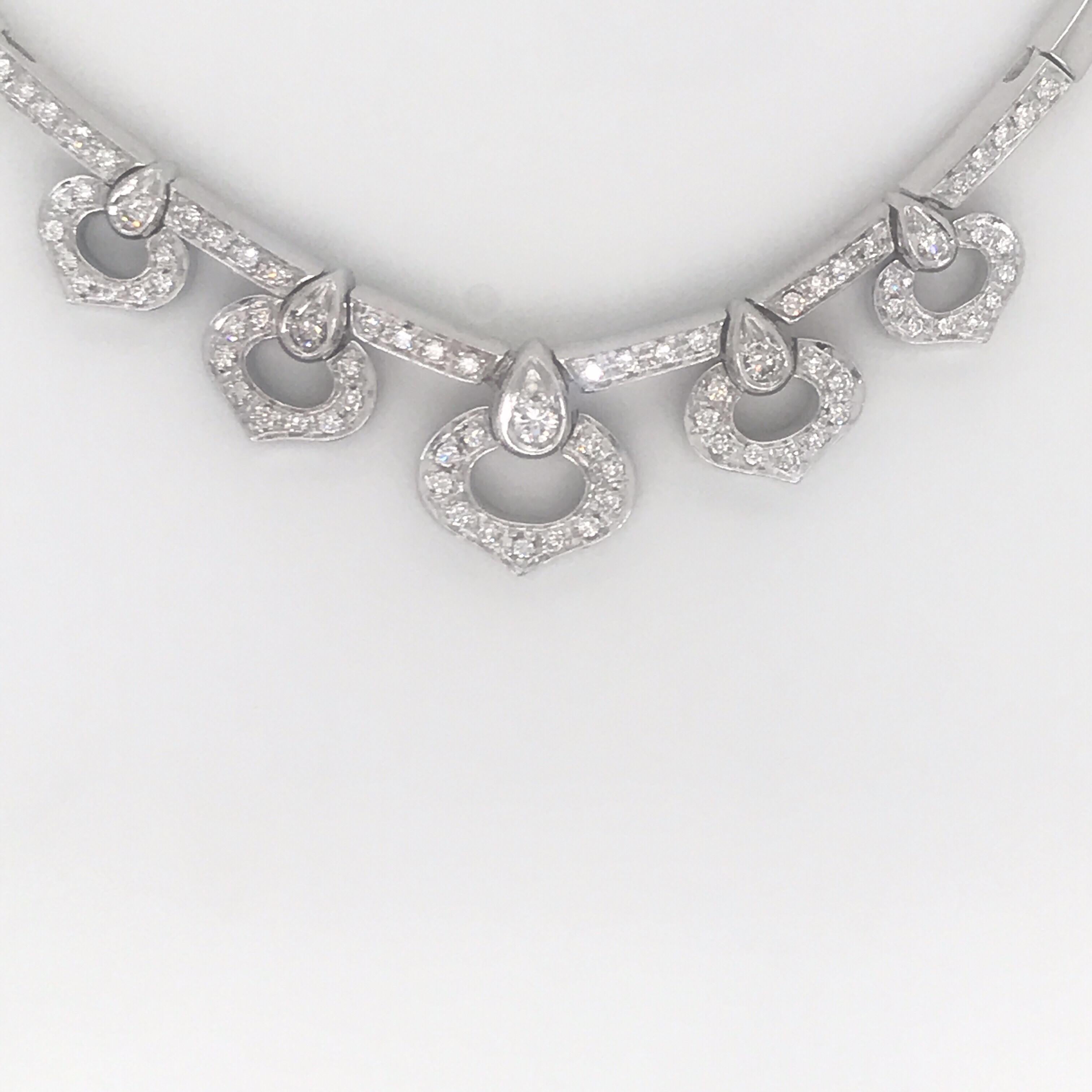 14K White gold necklace featuring 5 diamond drops weighing approximately 1 carat on a bar link chain. 
Color H
Clarity SI 