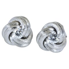 Diamond Ear Stud White Gold Medium Size Earrings in a Love Knot Motif.