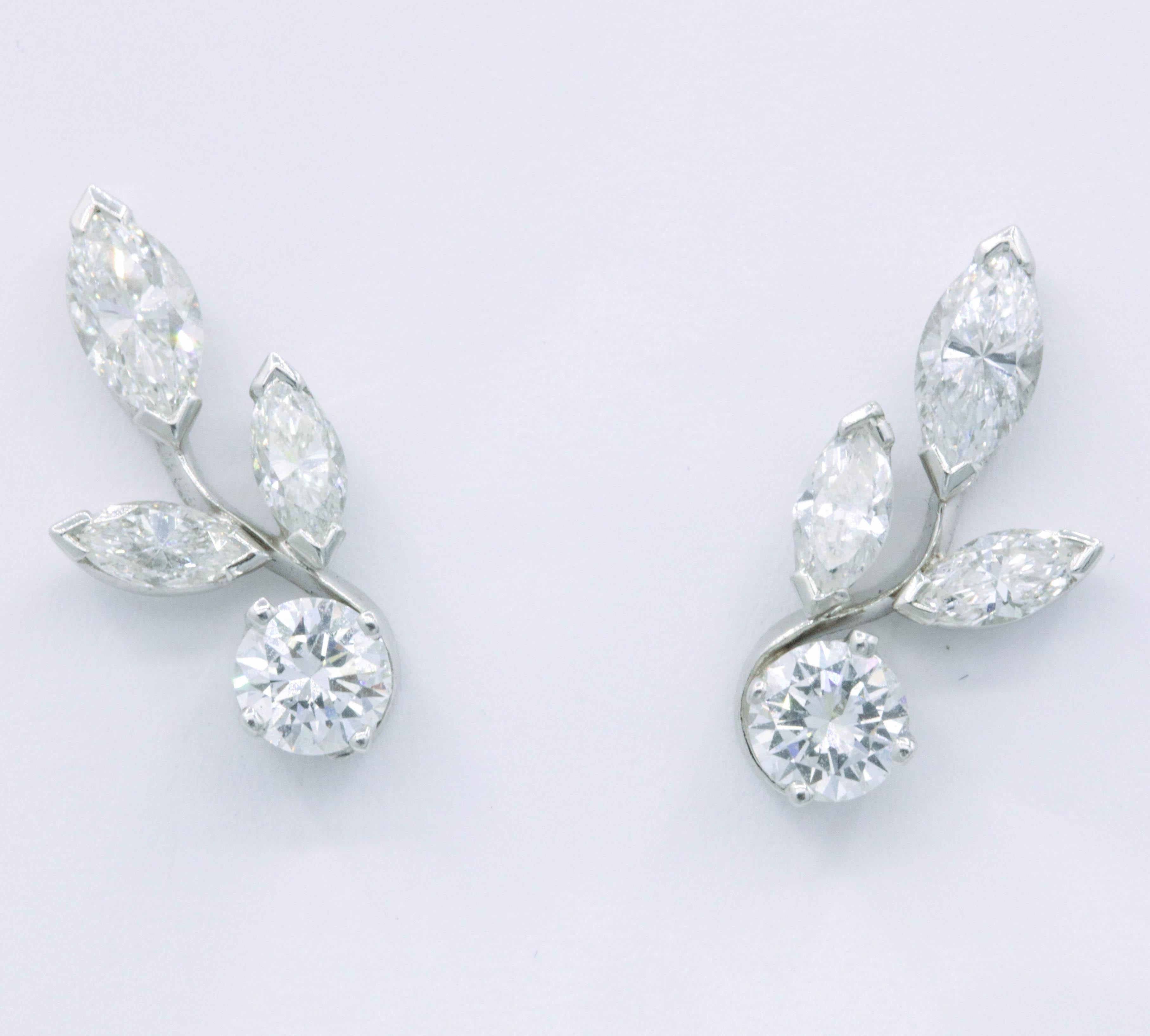 Platinum diamond earring climbers featuring 2 round brilliants, 0.70 cts, and 6 marquise diamonds weighing 1.00 cts. 
A very sweet pair to have in your collection!