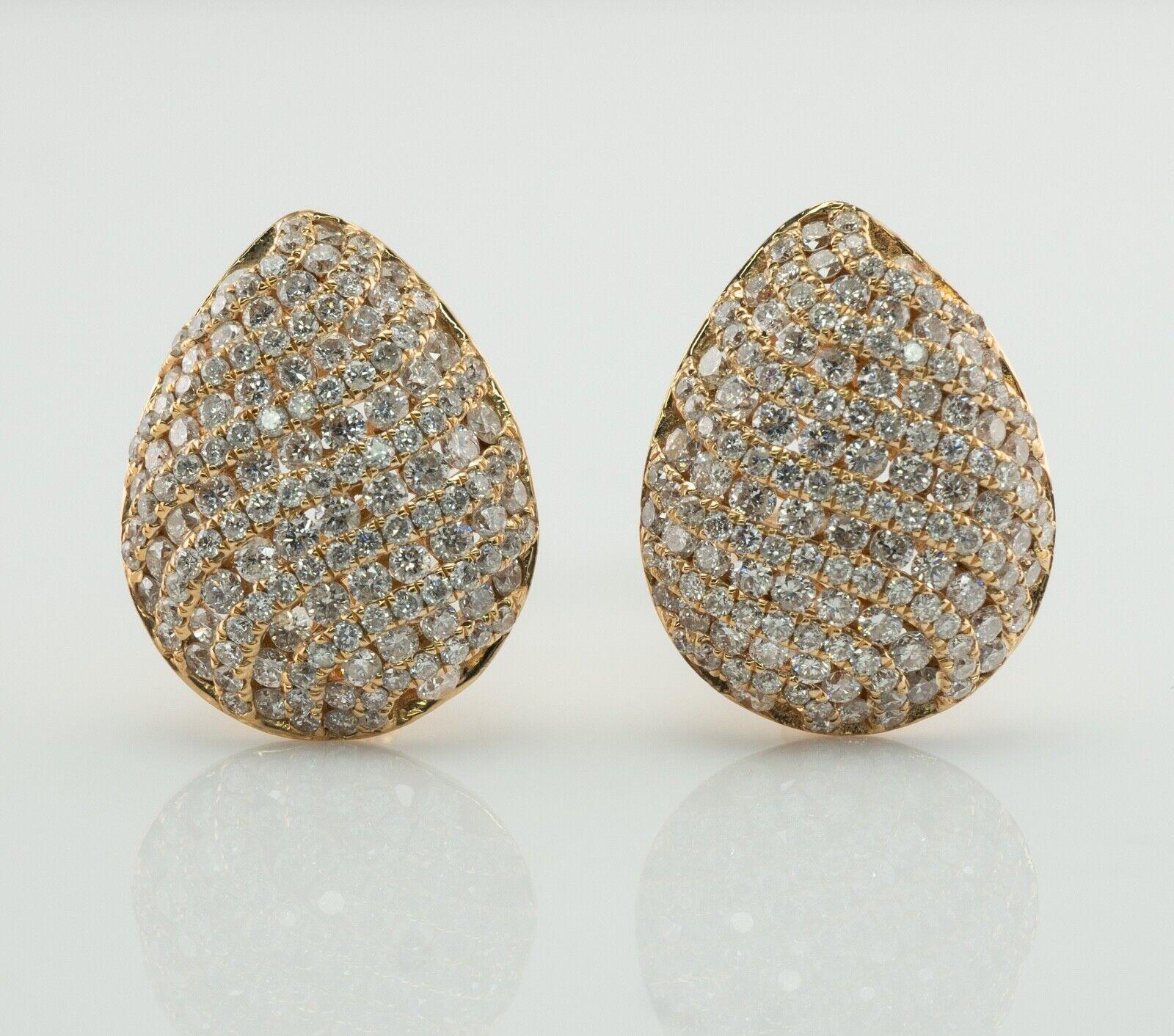 These estate diamond earrings are crafted in solid 14K Yellow Gold
Each earring is studded with 137 round cut diamonds.
The total diamond weight for the pair is 4.11 carats.
The diamonds are SI1 clarity and H color.
Each pear shape earring measures