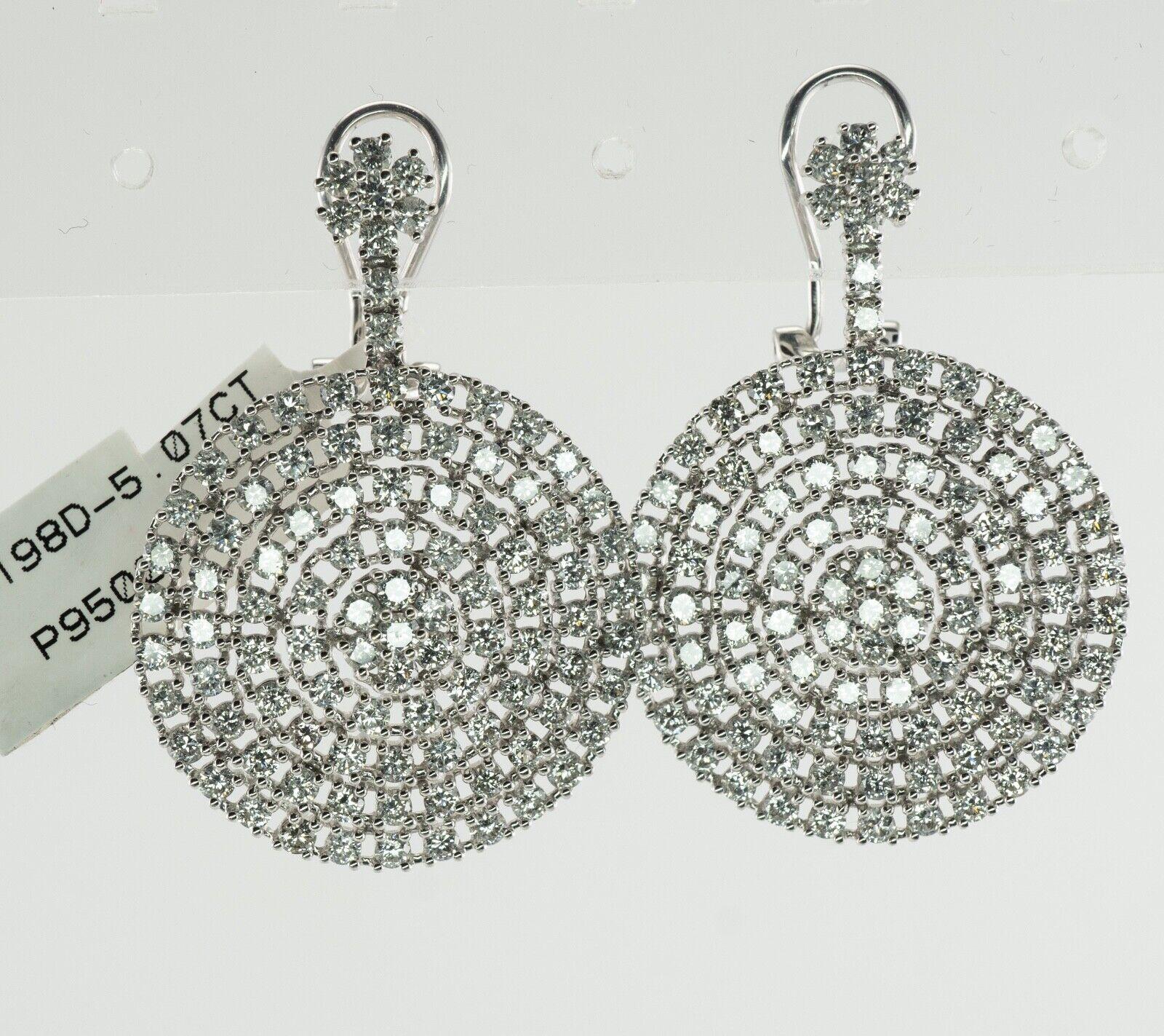 Diamond Earrings 14K White Gold Dangle Drop Geometric Round 5.07 TDW

This pair of diamond earrings is a brand new with a tag attached.
The earrings are made in solid 14K White Gold.
Each earring holds 99 round brilliant cut diamonds.
The diamonds