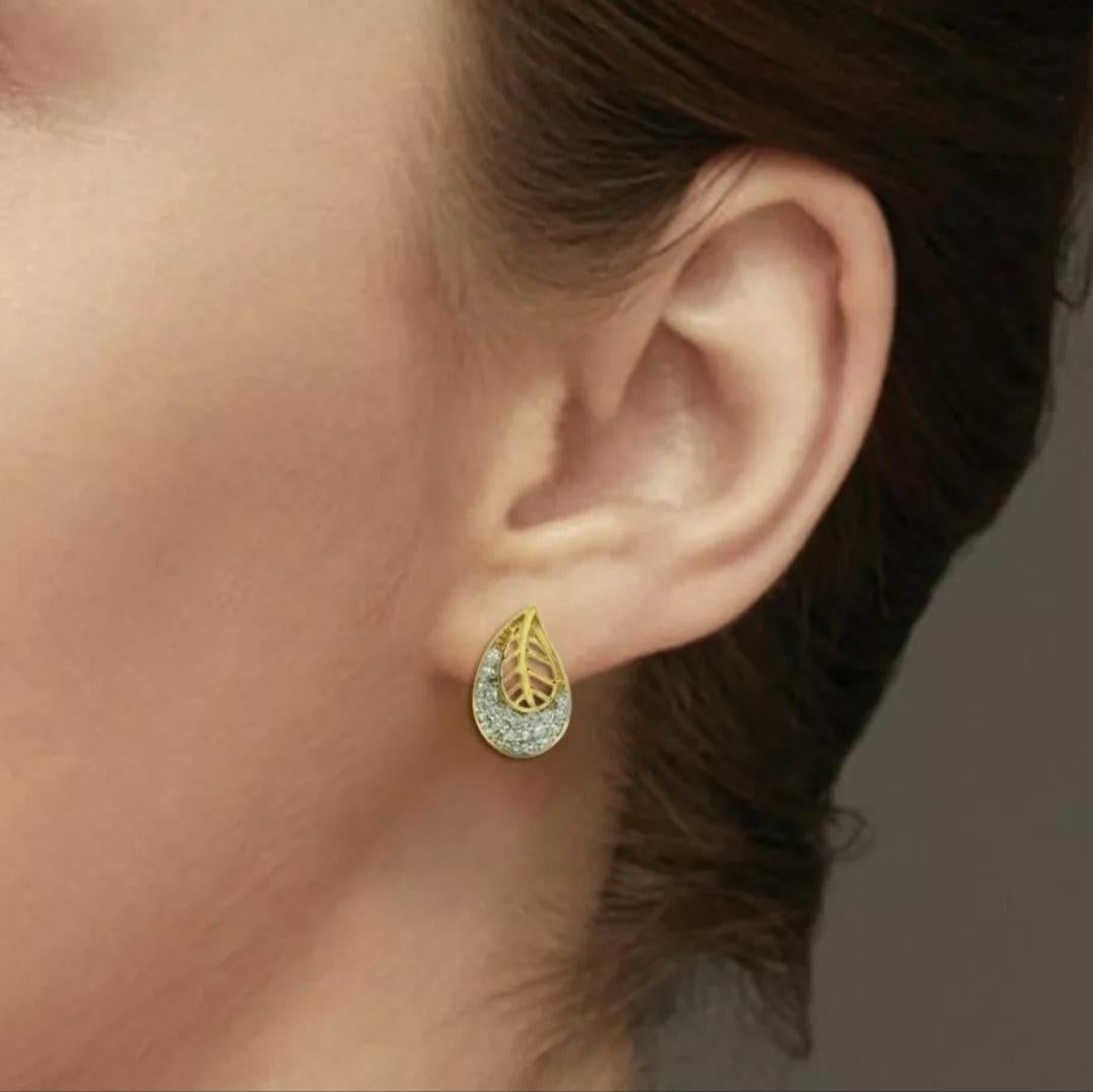 Diamond Earrings 14K Yellow Gold Leaf Studs Minimalist Flower Women Earrings.

Base Metal
Yellow Gold
Certification
BIS 14K Hallmarked, IGI
Material
14K Yellow Gold, Natural Diamond
Metal Purity
14k
Closure
Butterfly
Main Stone
Diamond

Diamond