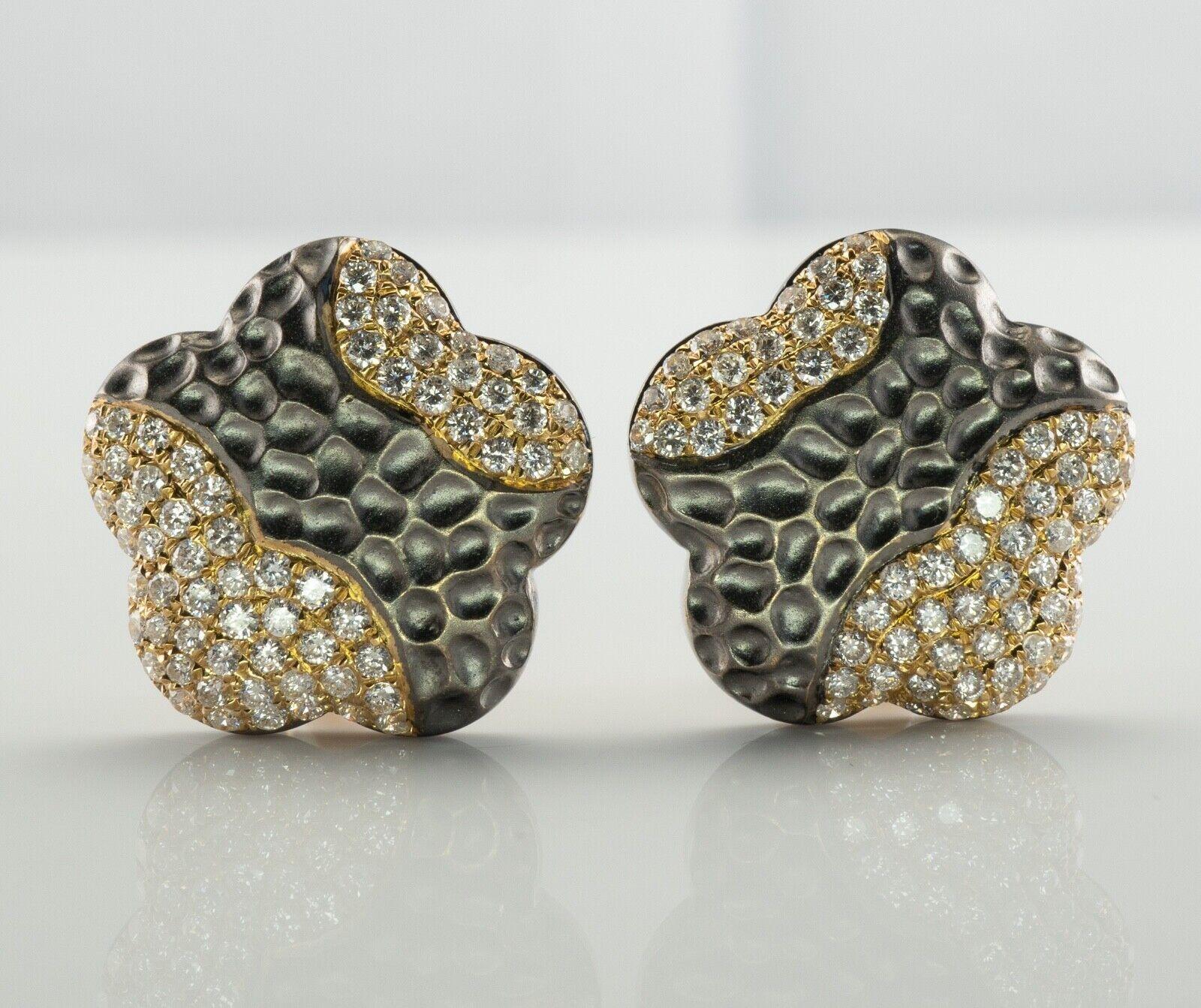 Diamond Earrings 18K Gold Hallmarked BA Flower Omega

This gorgeous pair of estate earrings is finely crafted in solid 18K Yellow gold and blackened gold. There are 68 round brilliant cut diamonds in each earrings. These gems are very clean VS2