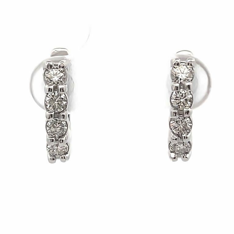 These exquisite English Lock earrings boast a breathtaking arrangement of white round diamonds weighing 0.72 carats in total. They elegantly adjust in the ear, showcasing the diamonds in a unique, modern one-row round diamonds design highlighting