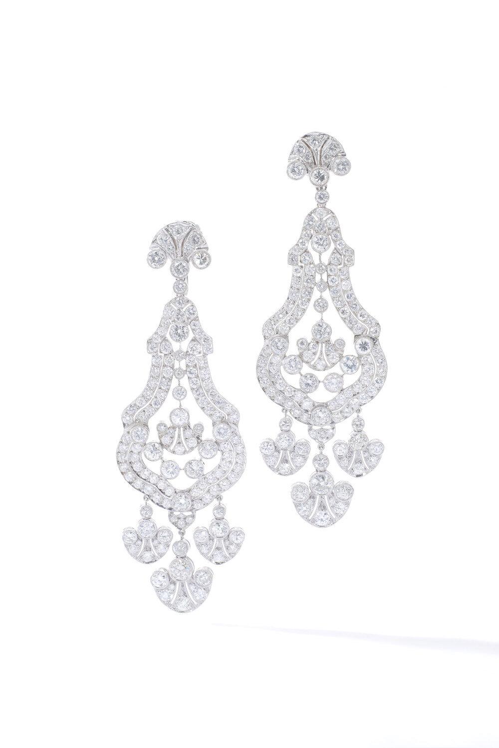 A pair of Diamond and Platinum Earrings. 
Old European and 8/8 cut diamonds: approximately 8.00-10.00 carats.
Length: 8.00 centimeters.

Some treasures never lose their luster. Enter the Antique Diamond and Platinum Ear Pendants, a dazzling revival