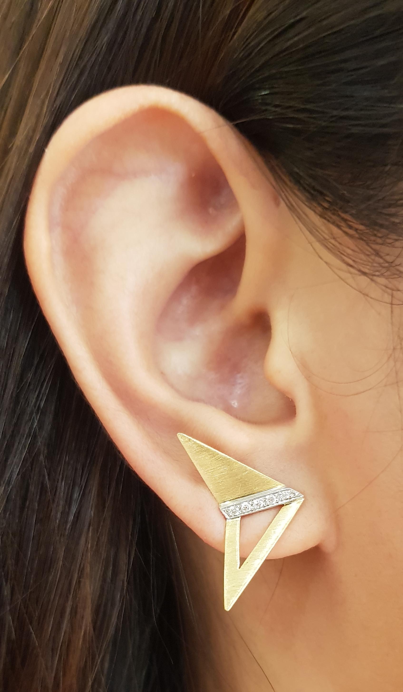 Diamond 0.10 carat Earrings set in 18 Karat Gold Settings 

Width: 1.7 cm 
Length: 2.3 cm
Total Weight: 4.37 grams

The ancient Japanese tradition of paper folding has inspired the form and elements of this modern collection. With a series of folds