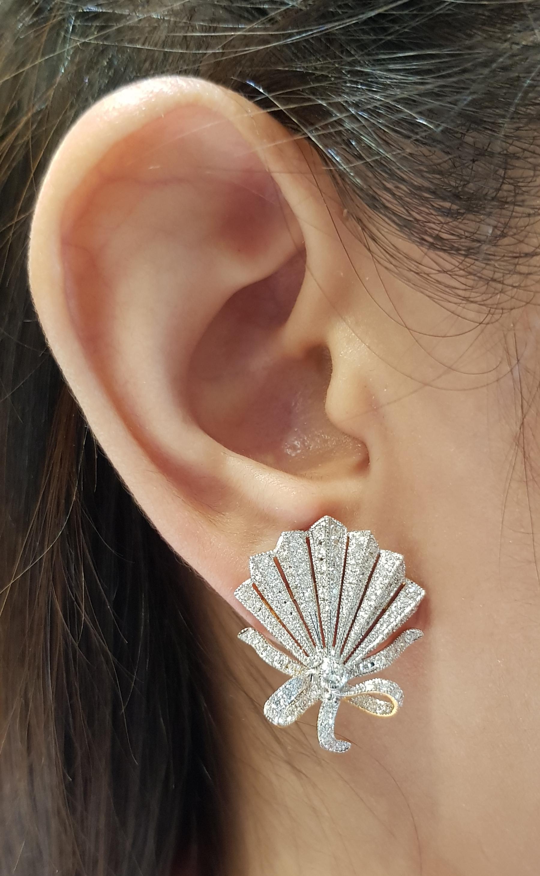 Diamond 1.50 carats Earrings set in 18 Karat Gold Settings

Width:  2.3 cm 
Length:  2.5 cm
Total Weight: 10.13 grams

