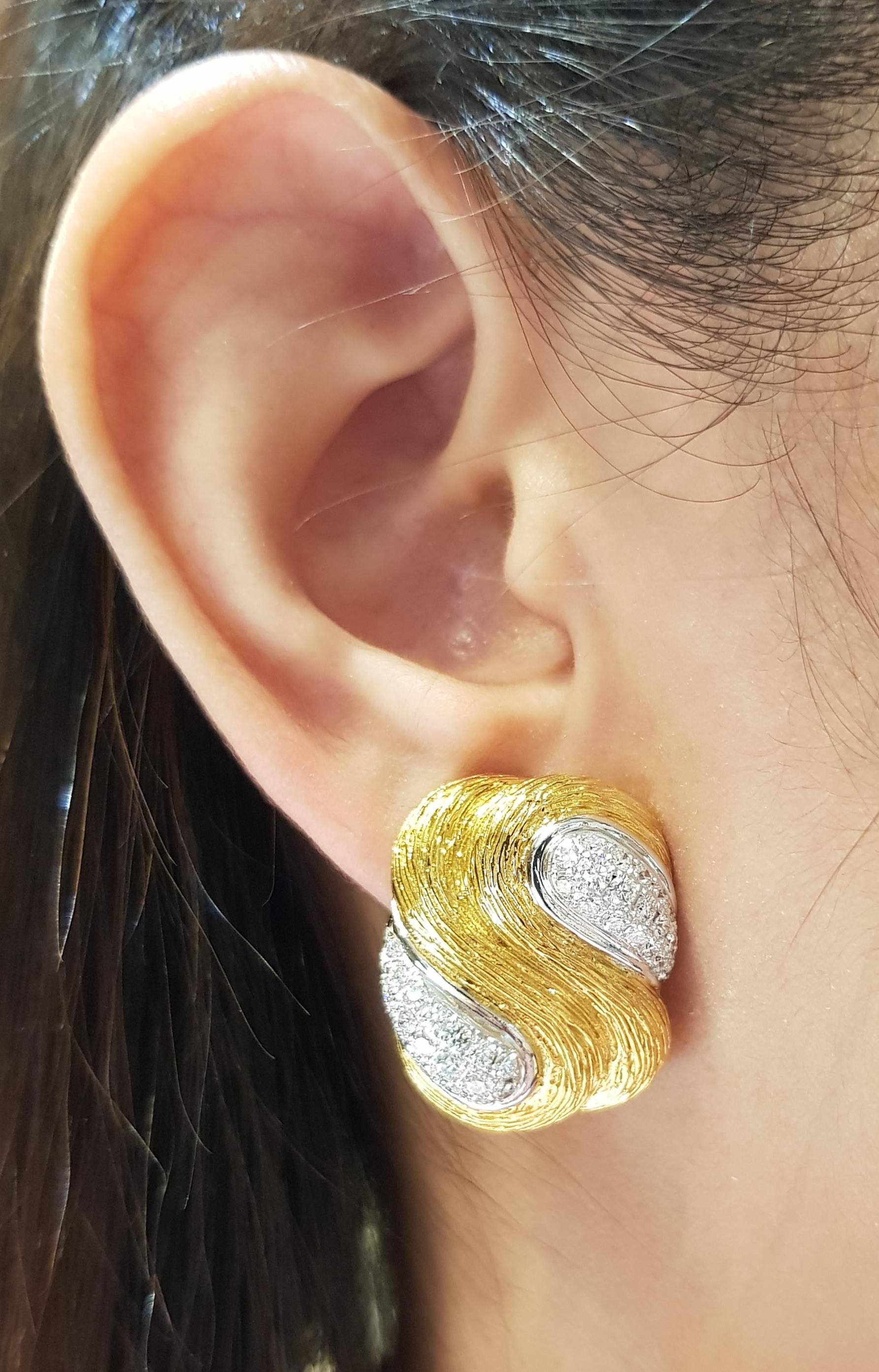 Diamond 1.74 carats Earrings set in 18 Karat Gold Settings

Width:  2.0 cm 
Length:  2.5 cm
Total Weight: 21.75 grams

