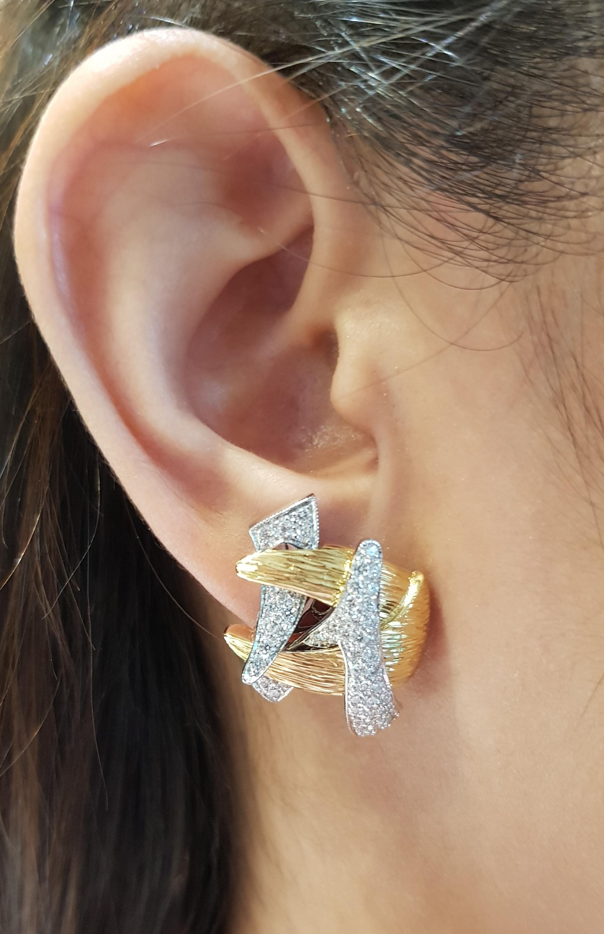 Diamond 1.64 carats Earrings set in 18 Karat Gold Settings

Width:  2.6 cm 
Length:  2.1 cm
Total Weight: 18.53 grams


