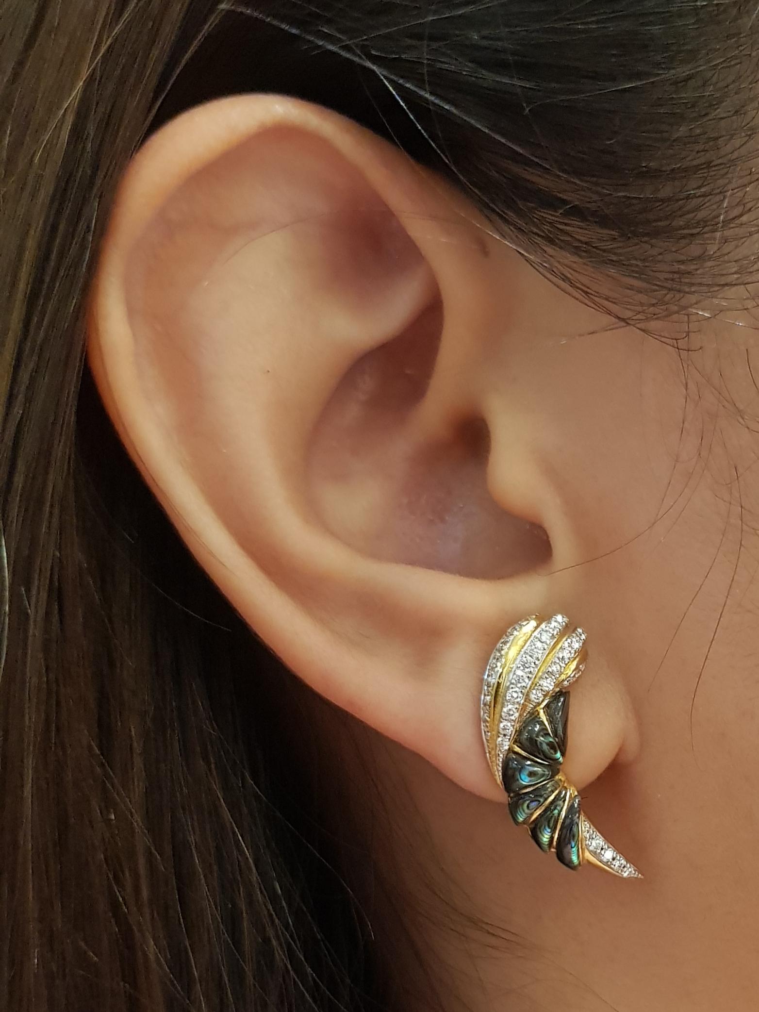 Diamond 0.56 carat Earrings set in 18 Karat Gold Settings

Width:  1.0 cm 
Length:  2.5 cm
Total Weight: 8.04 grams

